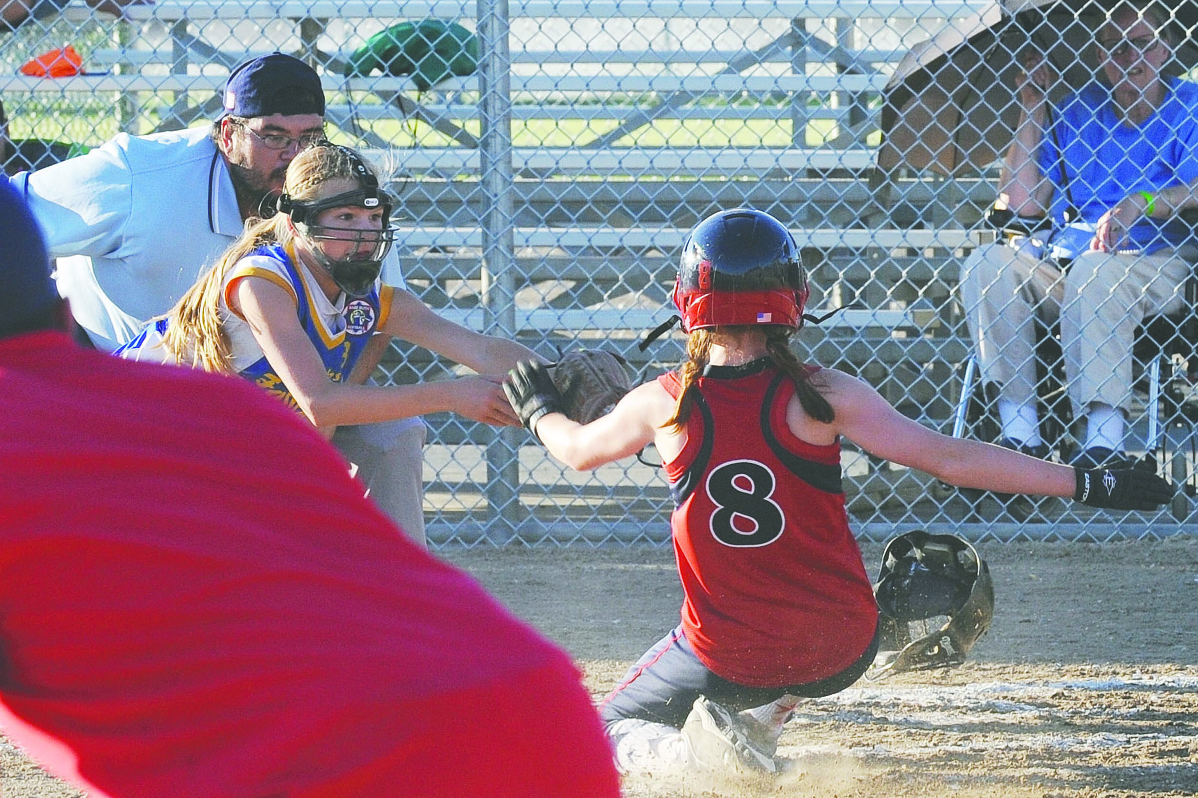 Forks 10U pitcher Jayden Olson covers home to tag out a Hoquiam runner during pool play earlier in the state tournament in Othello. Forks beat Hoquiam 12-2 this time and then defeated Hoquiam 3-0 in the championship game Sunday. Lonnie Archibald/for Peninsula Daily News