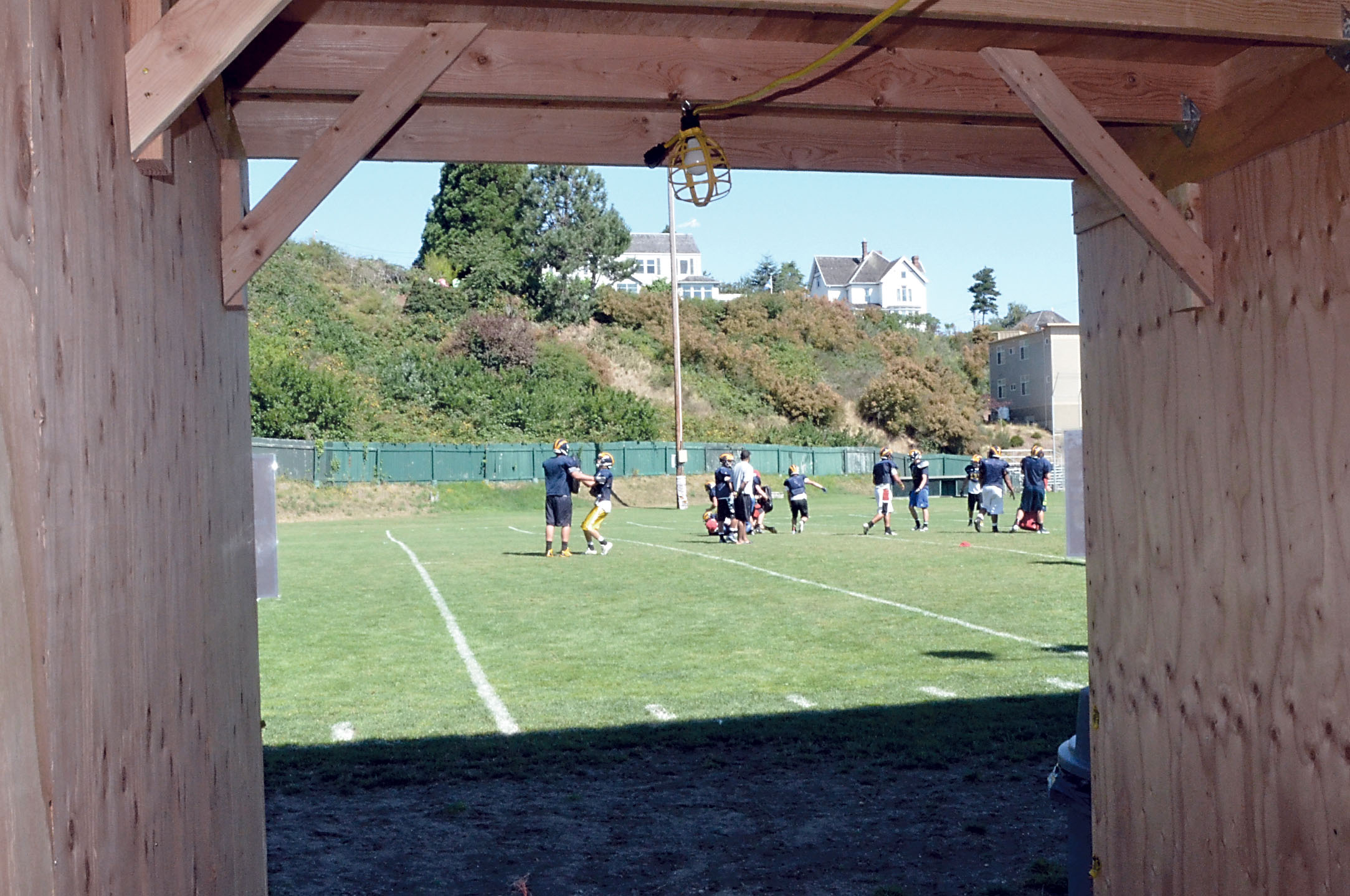 A temporary wooden tunnel opens out onto Memorial Field in Port Townsend.  Photo by Charlie Bermant/Peninsula Daily News