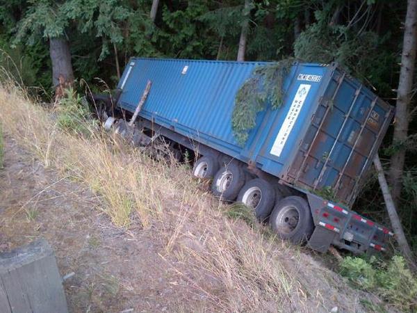 The driver of this tractor-trailer was killed when the truck left state Highway 104 west of the Hood Canal bridge and struck several trees. Russ WInger/Washington State Patrol