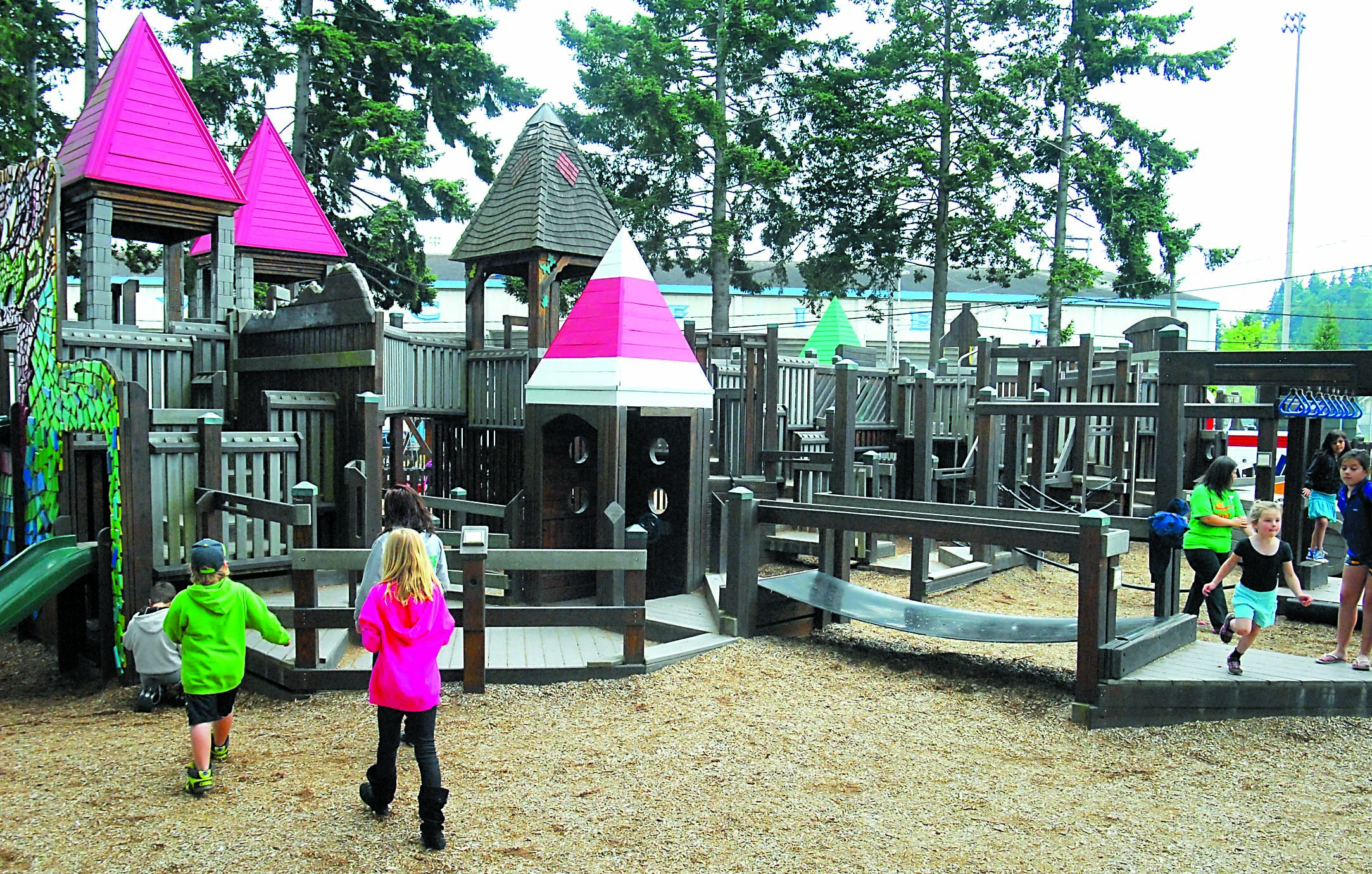 Children play at the Dream Playground at Erickson Playfield in Port Angeles on Tuesday. Keith Thorpe/Peninsula Daily News