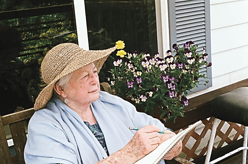 Dorothea Morgan draws a scene of her Eden Valley backyard from her porch.