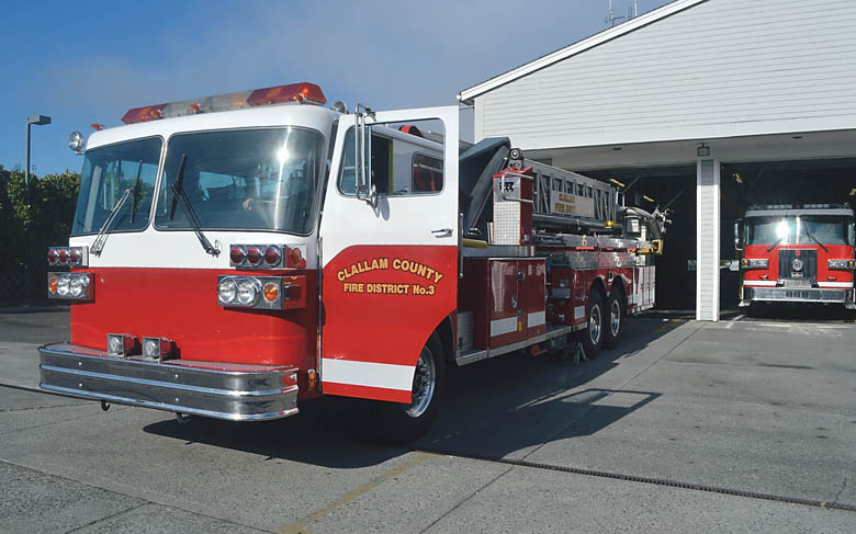Clallam County Fire District No. 3's 1983 ladder truck will be one of the highlights of a parade marking 100 years of fire protection in the Sequim-Dungeness Valley on Saturday. Joe Smillie/Peninsula Daily News
