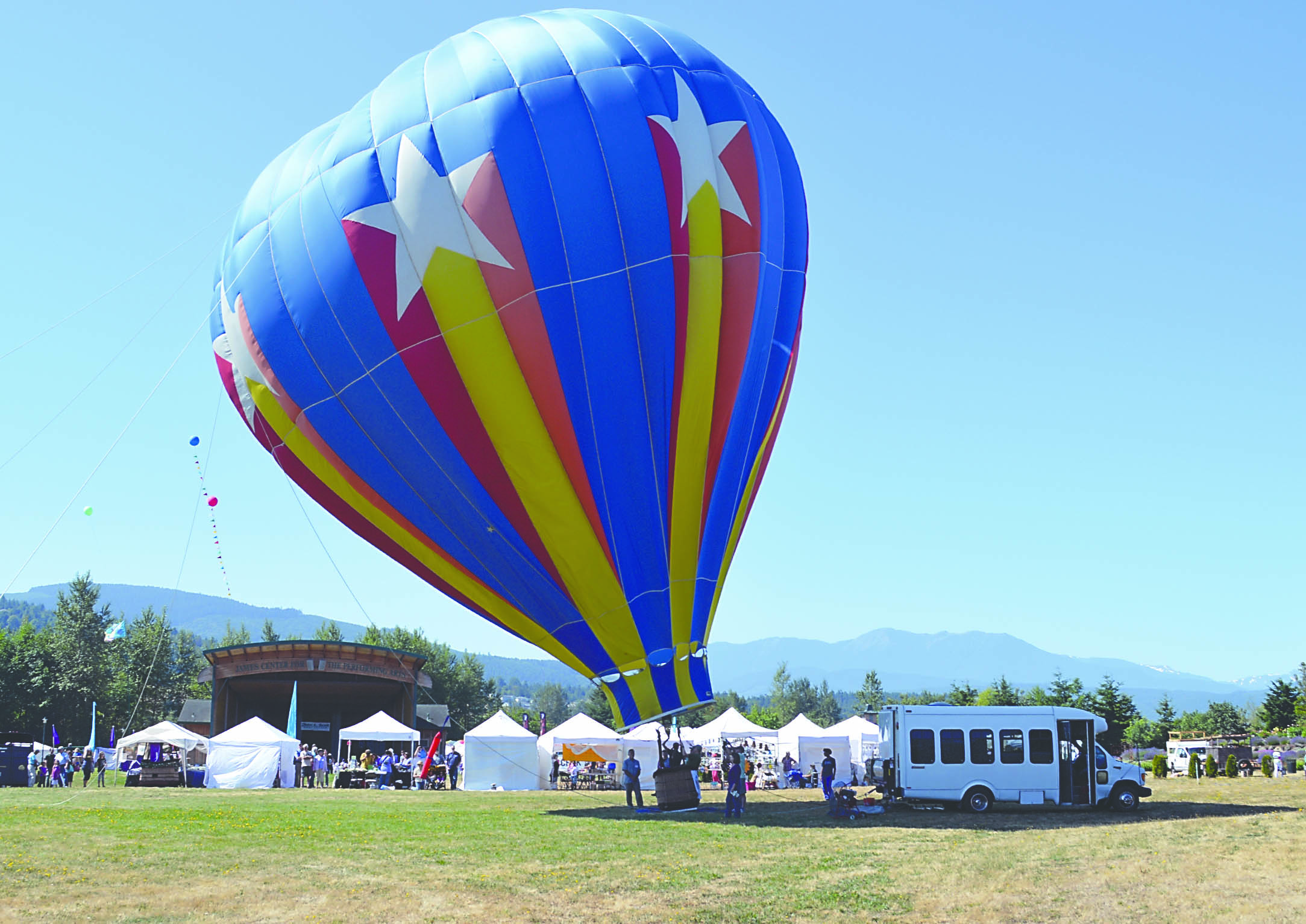 Capt. Crystal Stout’s hot-air balloon inflates over Sequim’s Lavender Weekend in July.  -- Photo by Joe Smillie/Peninsula Daily News