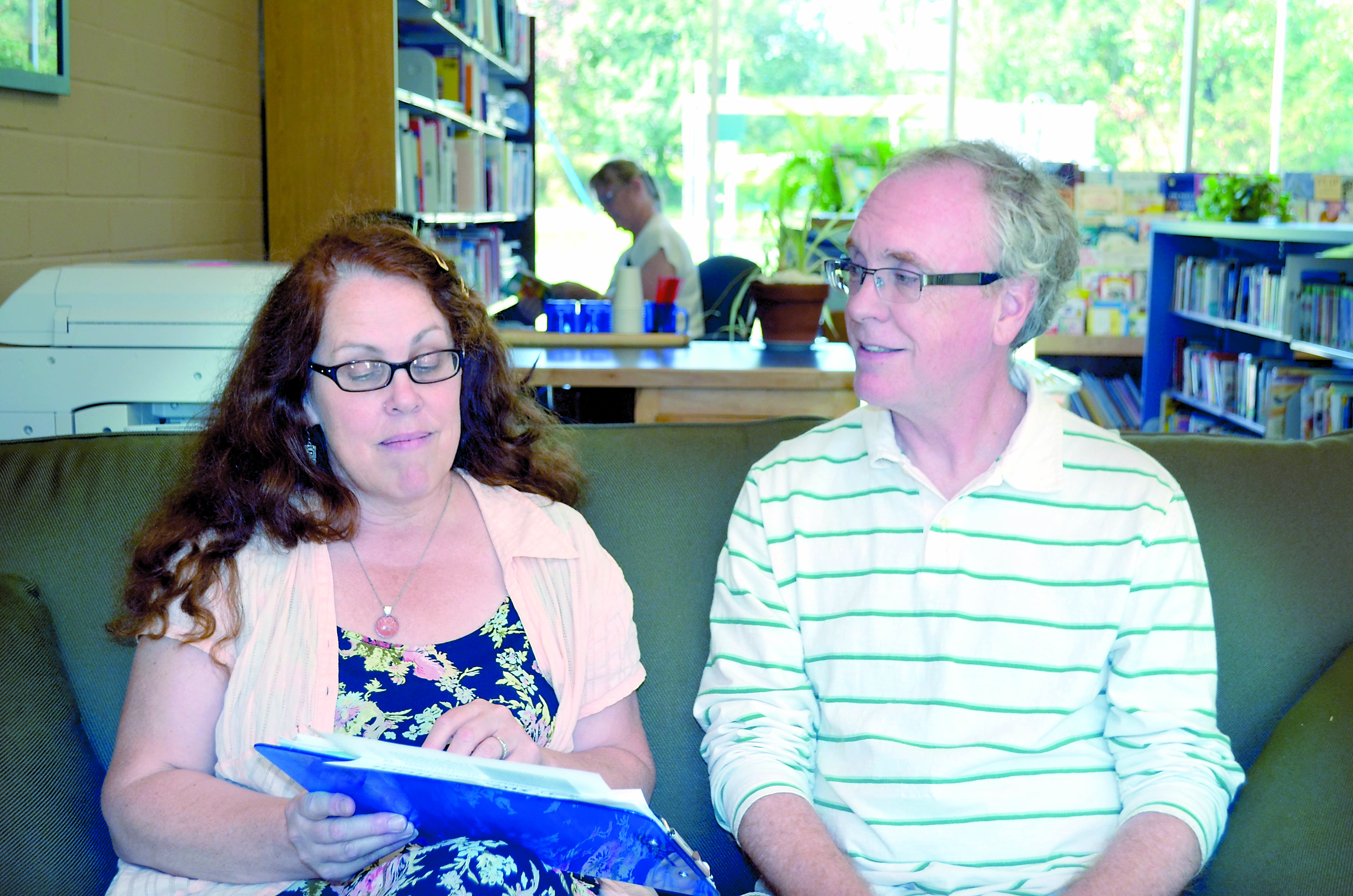 Swan Schools assistant head Bonnie White and head Russ Yates discuss the new year-round schedule that begins today.  -- Photo by Charlie Bermant/Peninsula Daily News