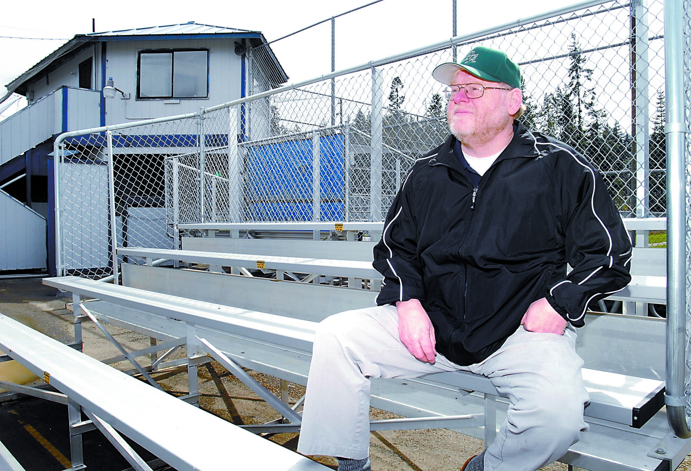 Longtime North Olympic Baseball and Softball president Jim Lunt looks out over a Lincoln Park playfield in 2009. Lunt died Monday at age 71. Keith Thorpe/Peninsula Daily News
