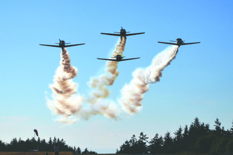 The Diamond Point Swift Formation Team flies over 2013's inaugural Olympic Peninsula Air Affaire.