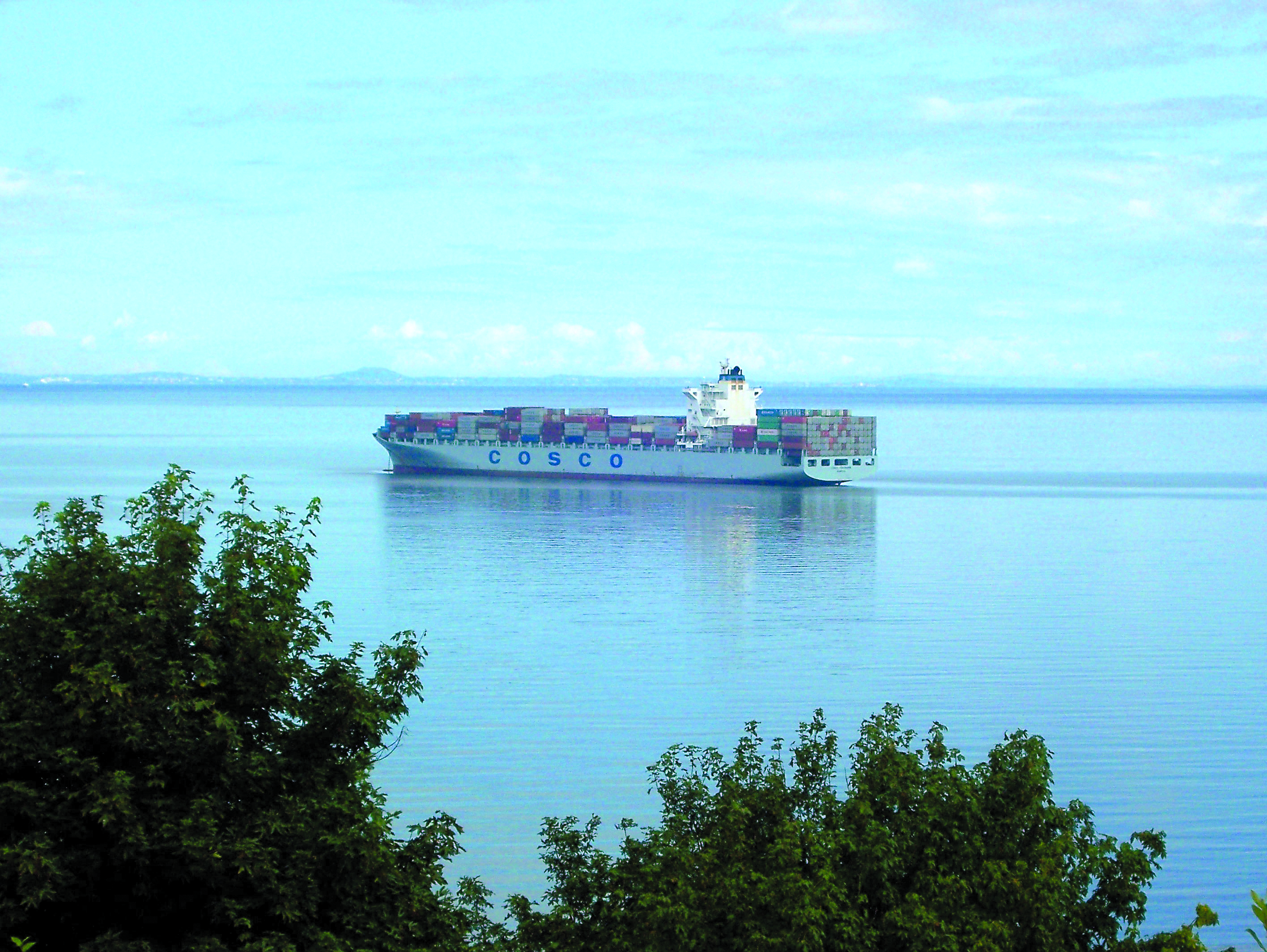 The Cosco Yokohama sits anchored at the east end of Port Angeles Harbor. The cargo ship experienced engine trouble and had to wait for Coast Guard clearance before getting under way for Japan.  -- Photo by David G. Sellars/for Peninsula Daily News