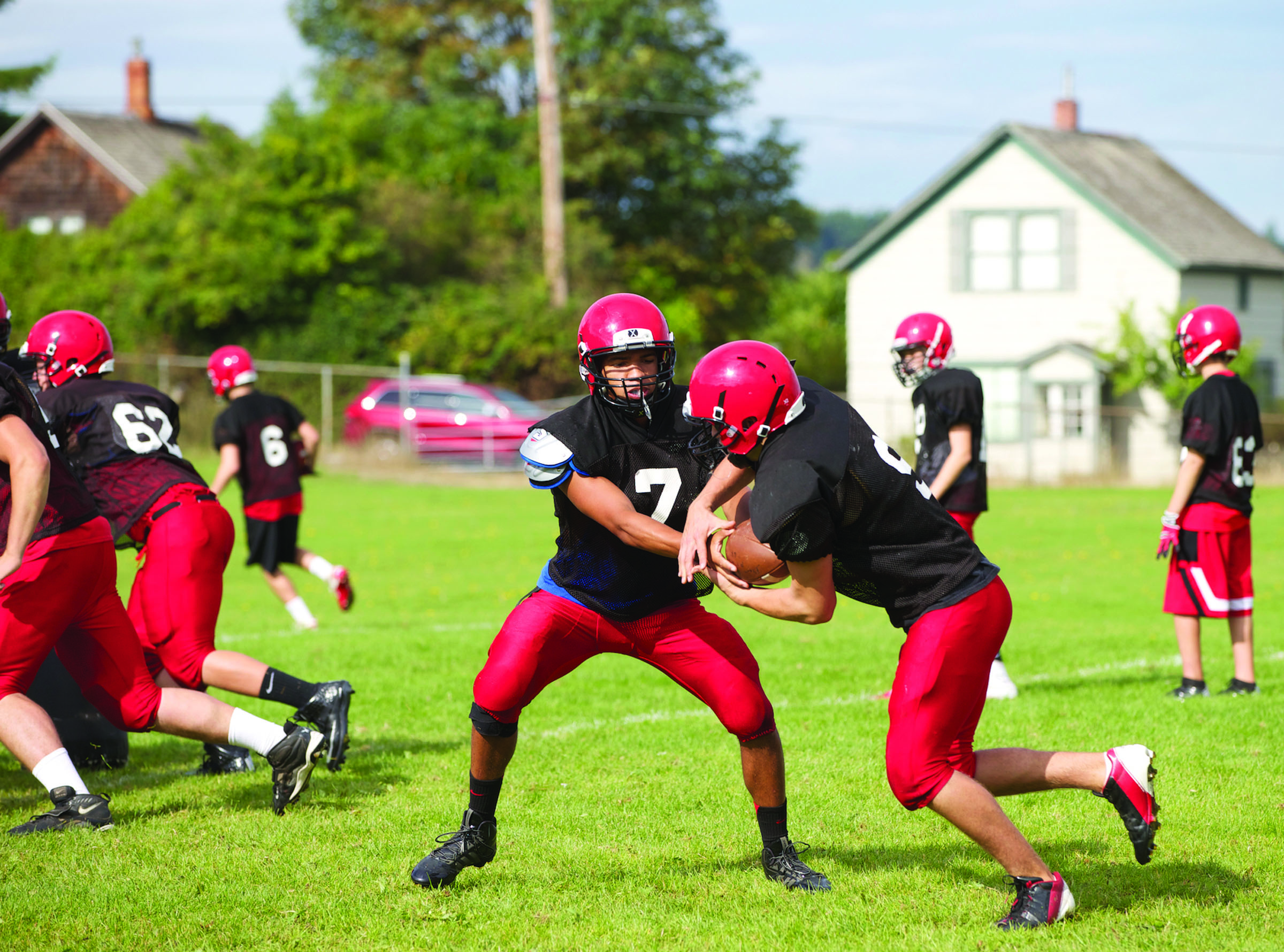 Port Townsend quarterback Jacob King (7) hands off to Liam Anderson during practice. Steve Mullensky/for Peninsula Daily News