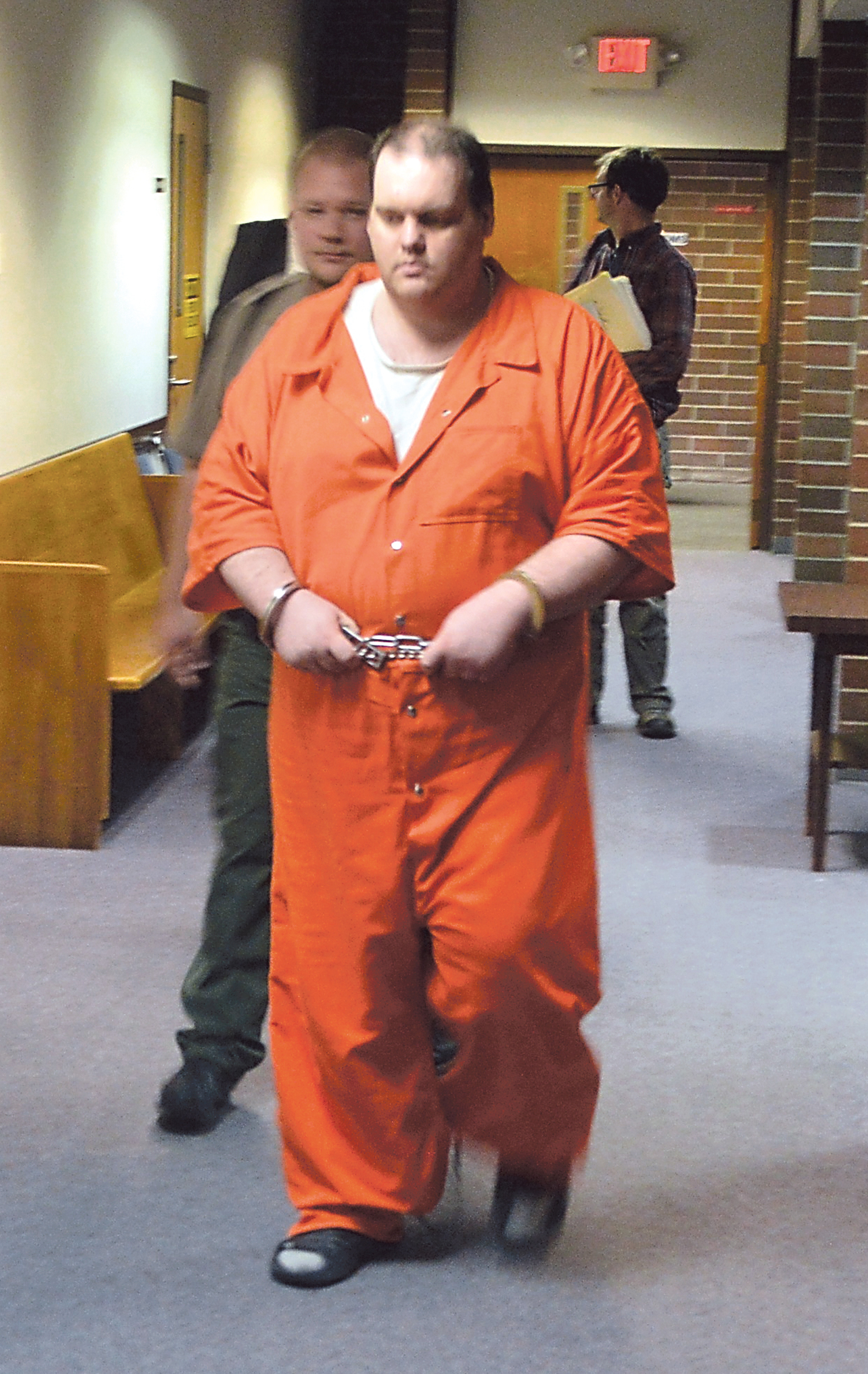 Accused double-murderer Michael Pierce is escorted in chains through the Kitsap County Courthouse hallways after his hearing ended Wednesday. —Photo by Joe Smillie/Peninsula Daily News