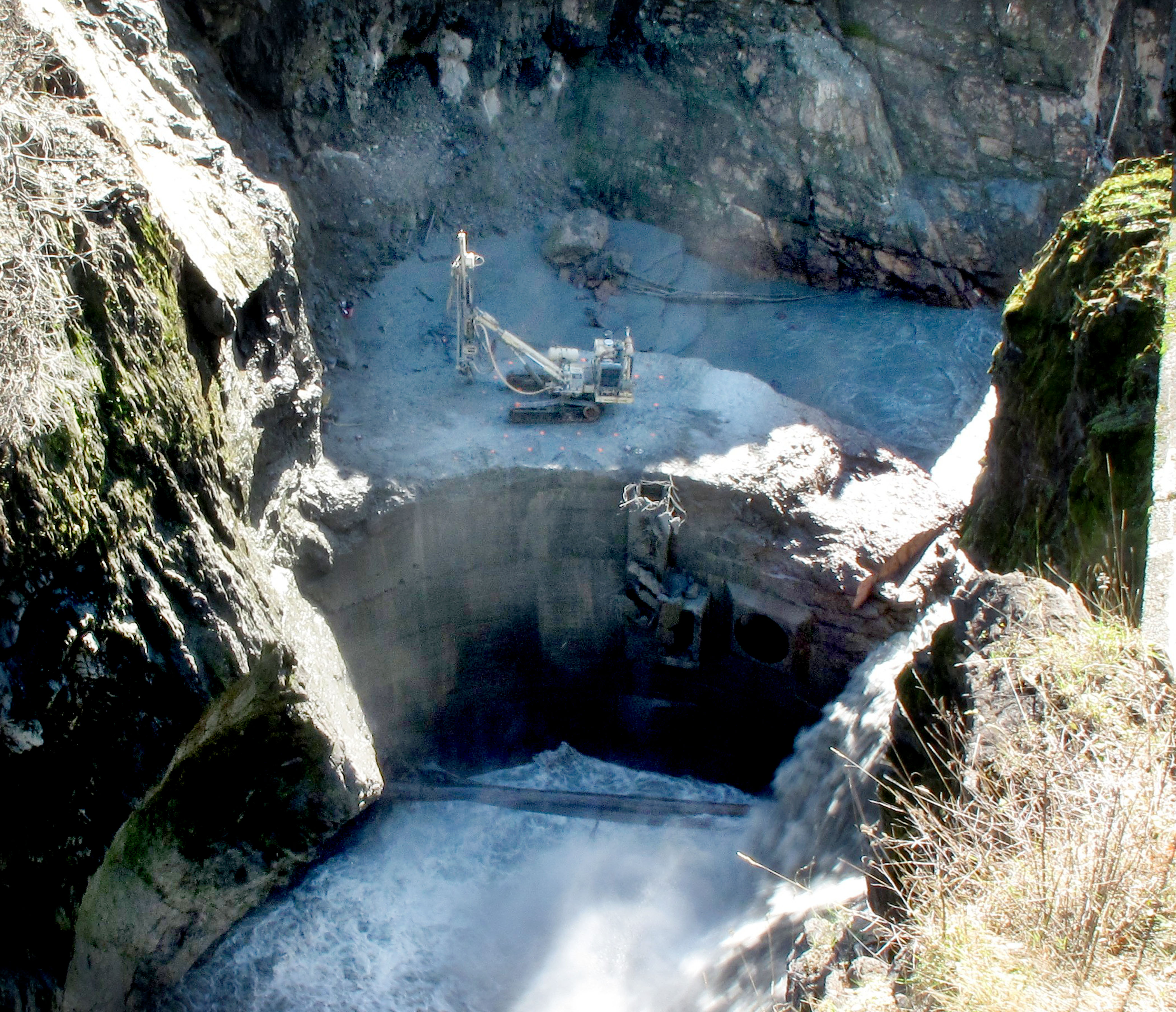 This Olympic National Park webcam photo shows equipment atop the remaining portion of Glines Canyon Dam