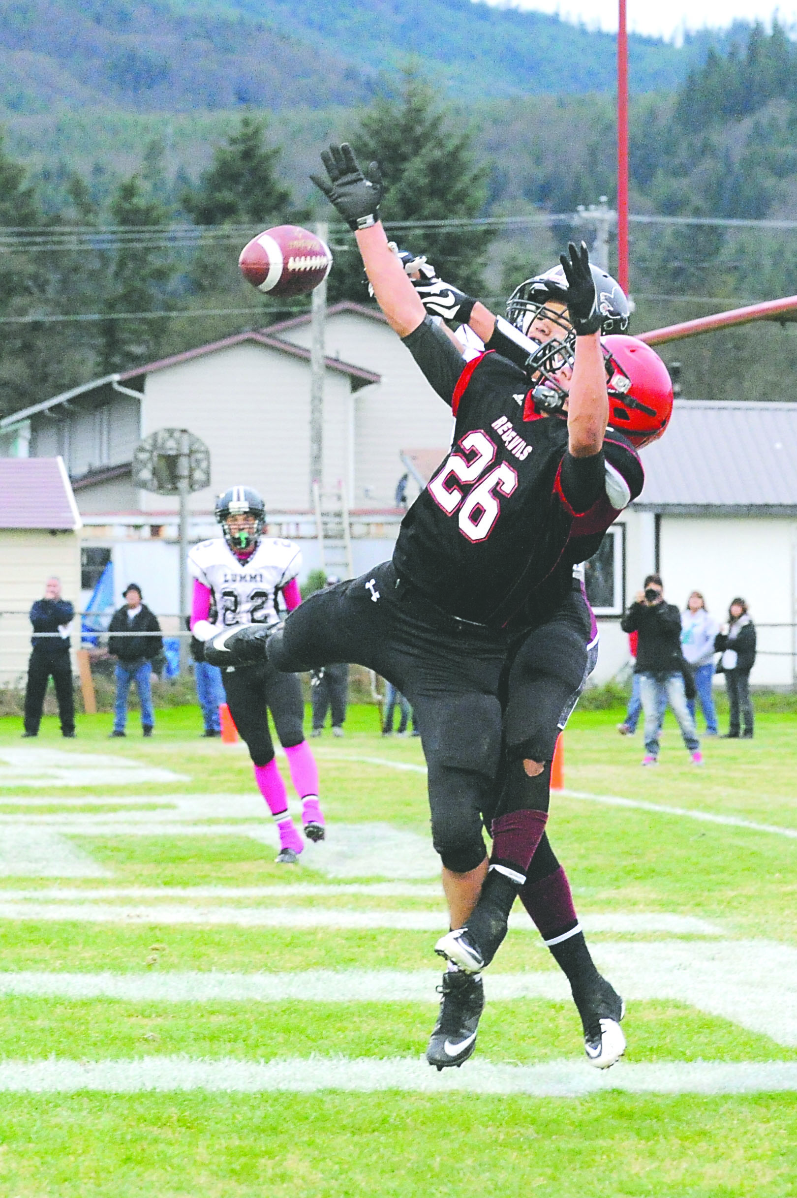 Neah Bay’s Zeke Greene (26) knocks down a pass in the end zone. Photo -- Lonnie Archibald/for Peninsula Daily News