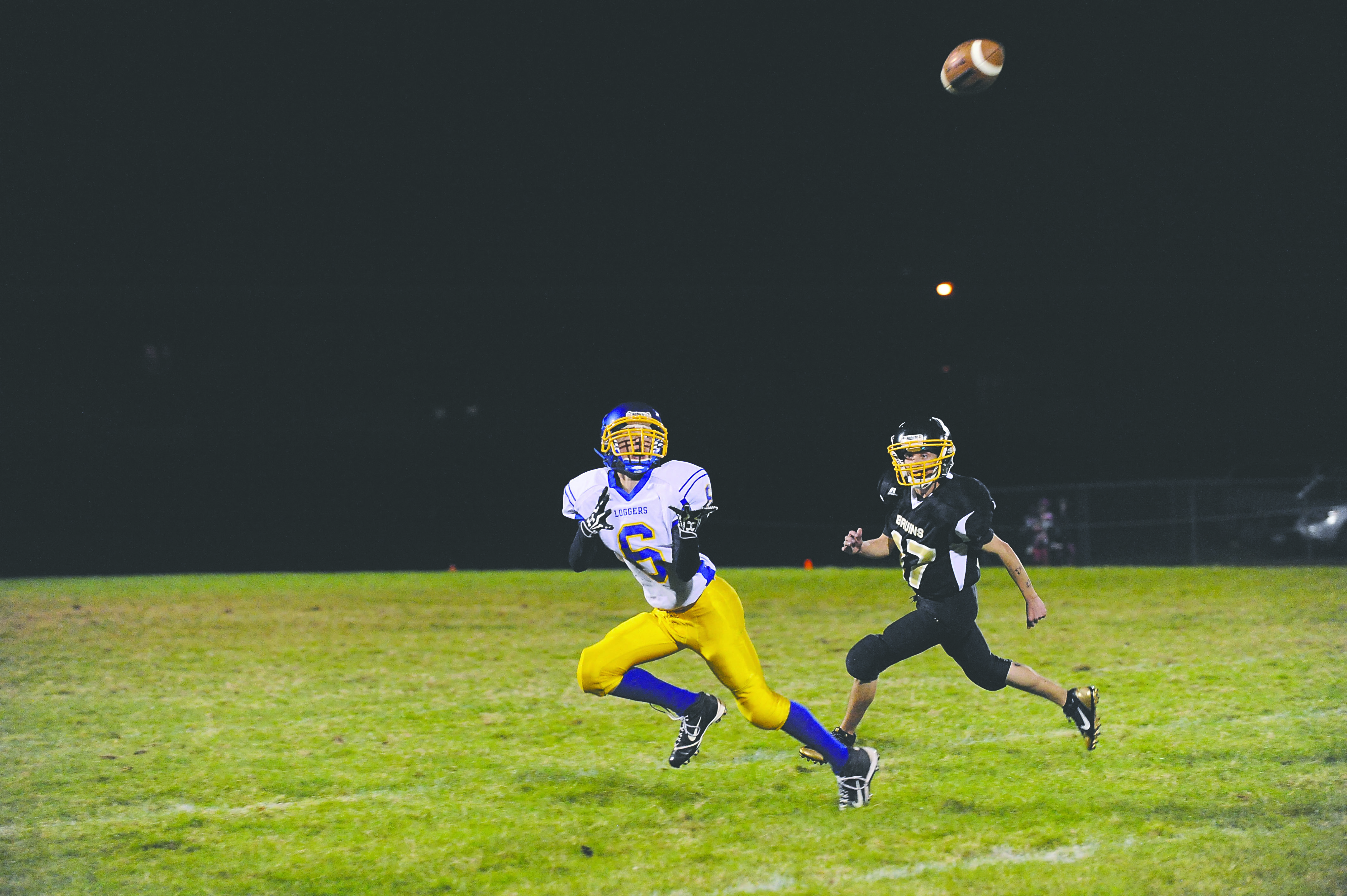 Crescent’s KC Spencer (6) hauls in a pass as Clallam Bay’s Travis James-Hunter closes in. Photo -- Lonnie Archibald/for Peninsula Daily News