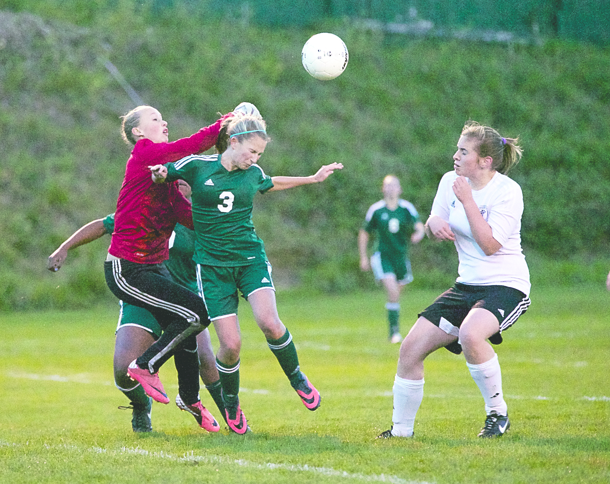 Port Townsend goalkeeper Malia Henderson races out to block a shot by Port Angeles' Madison St. George. Steve Mullensky/for Peninsula Daily News