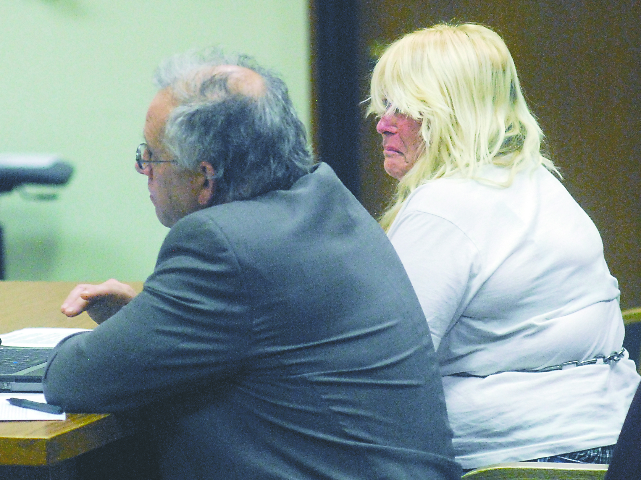 Marlene Terese Brand weeps as she sits in Clallam County Superior Court on Tuesday alongside public defender Harry Gasnick