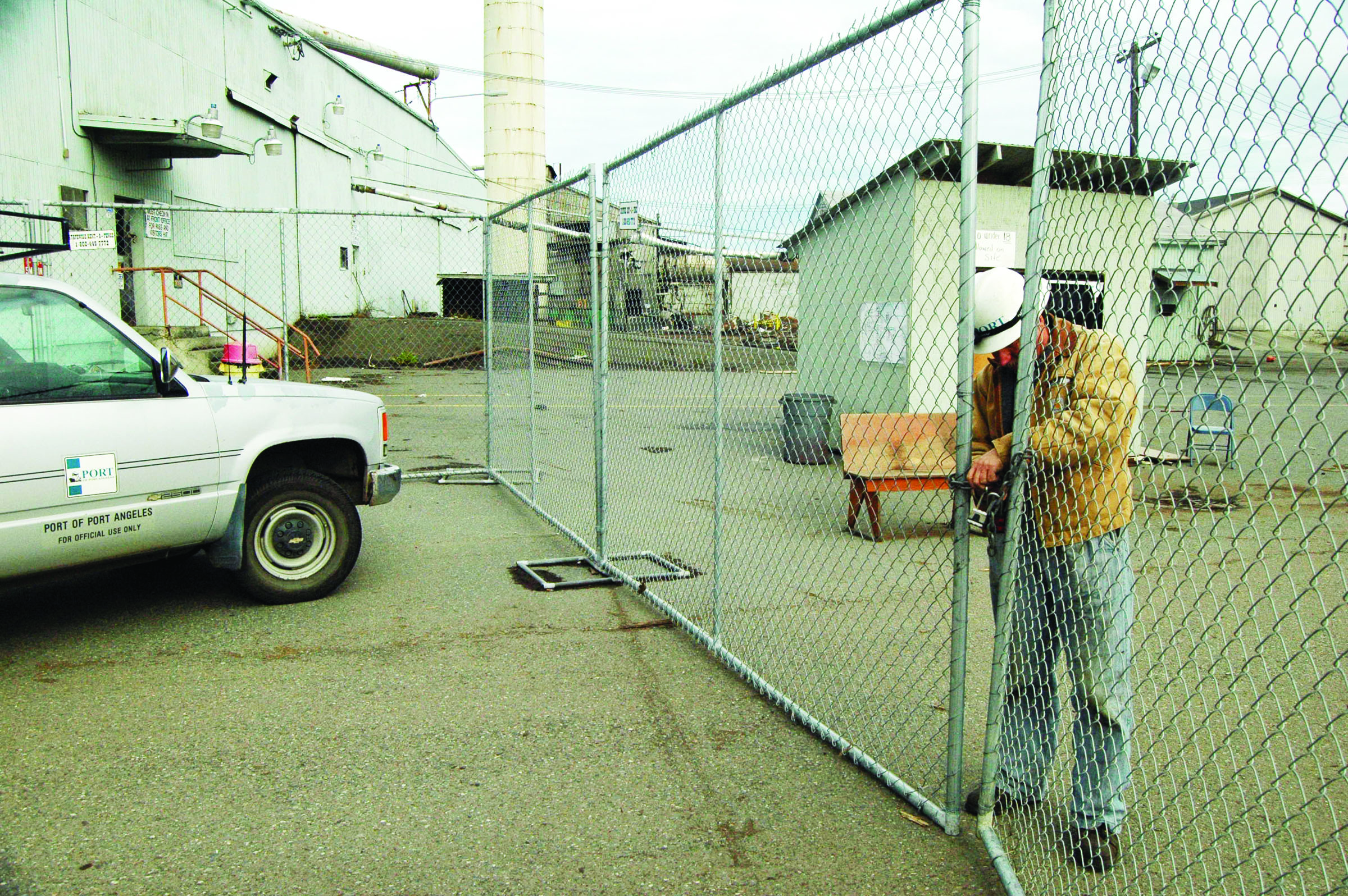 Port of Port Angeles facilities maintenance worker Bob Beaudette locks the gate to the former PenPly plywood mill