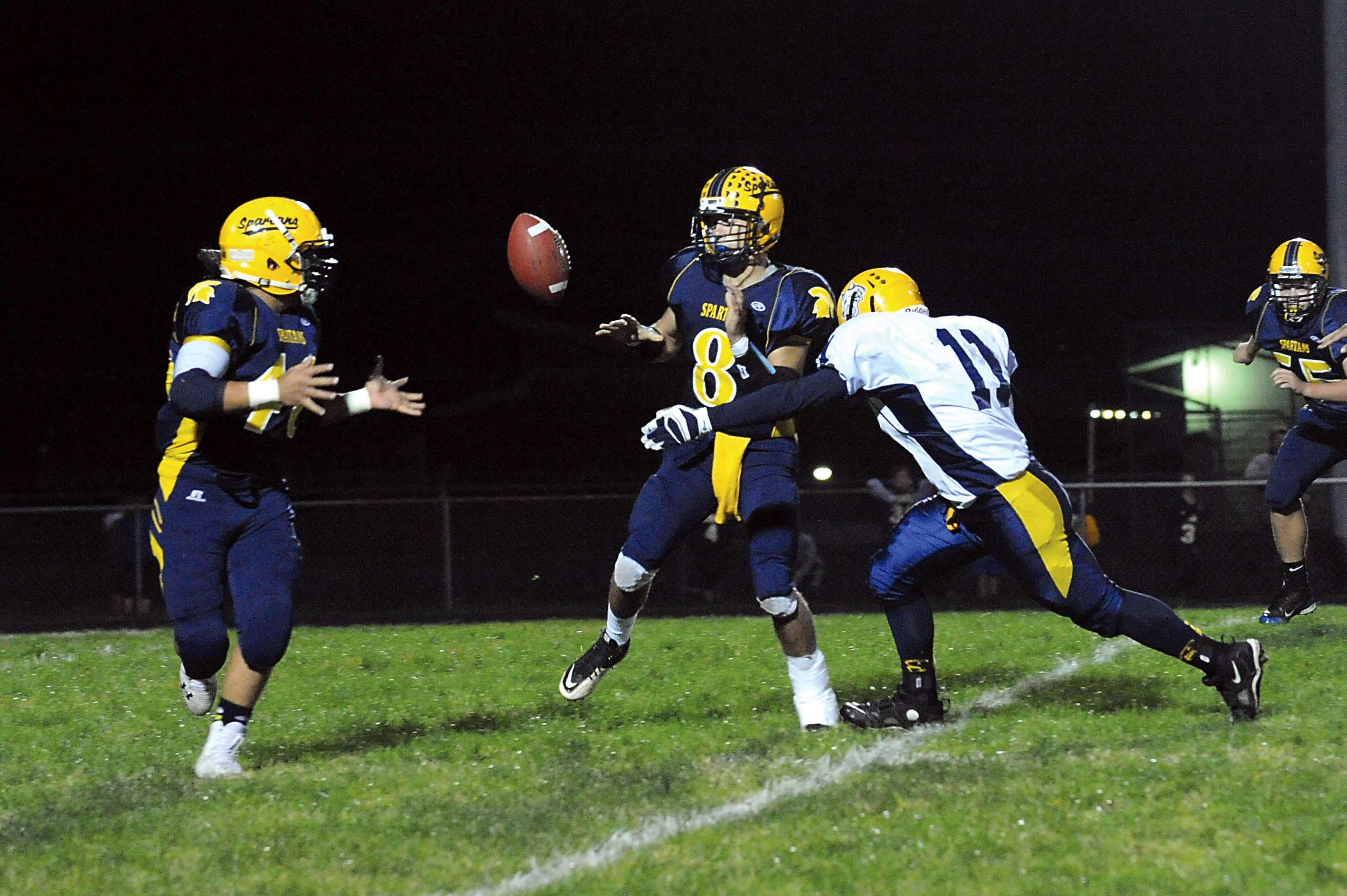 Forks' Javier Contreras (8) is hit by Aberdeen's Justin Baldwin as he pitches to Dimitri Sampson (40). Lonnie Archibald/for Peninsula Daily News