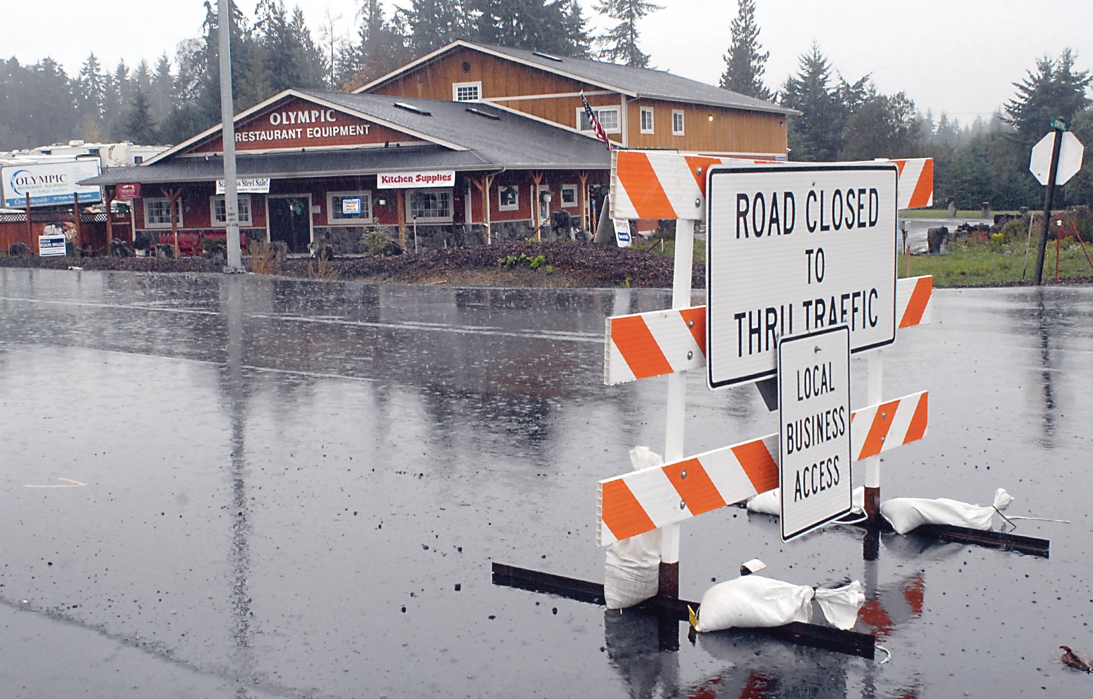 A road barricade sits on an older stretch of U.S. Highway 101 at Dryke Road west of Sequim