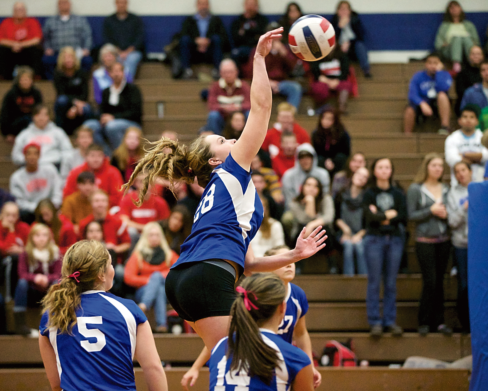 Teammates watch as Chimacum's Lauren Thacker spikes the ball during the Cowboys' home game against the Port Townsend Redskins. Chimacum beat its rival in three sets. Steve Mullensky/for Peninsula Daily News