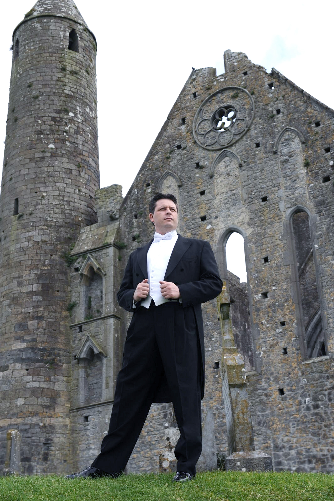 Anthony Kearns stands at Ireland's Rock of Cashel.