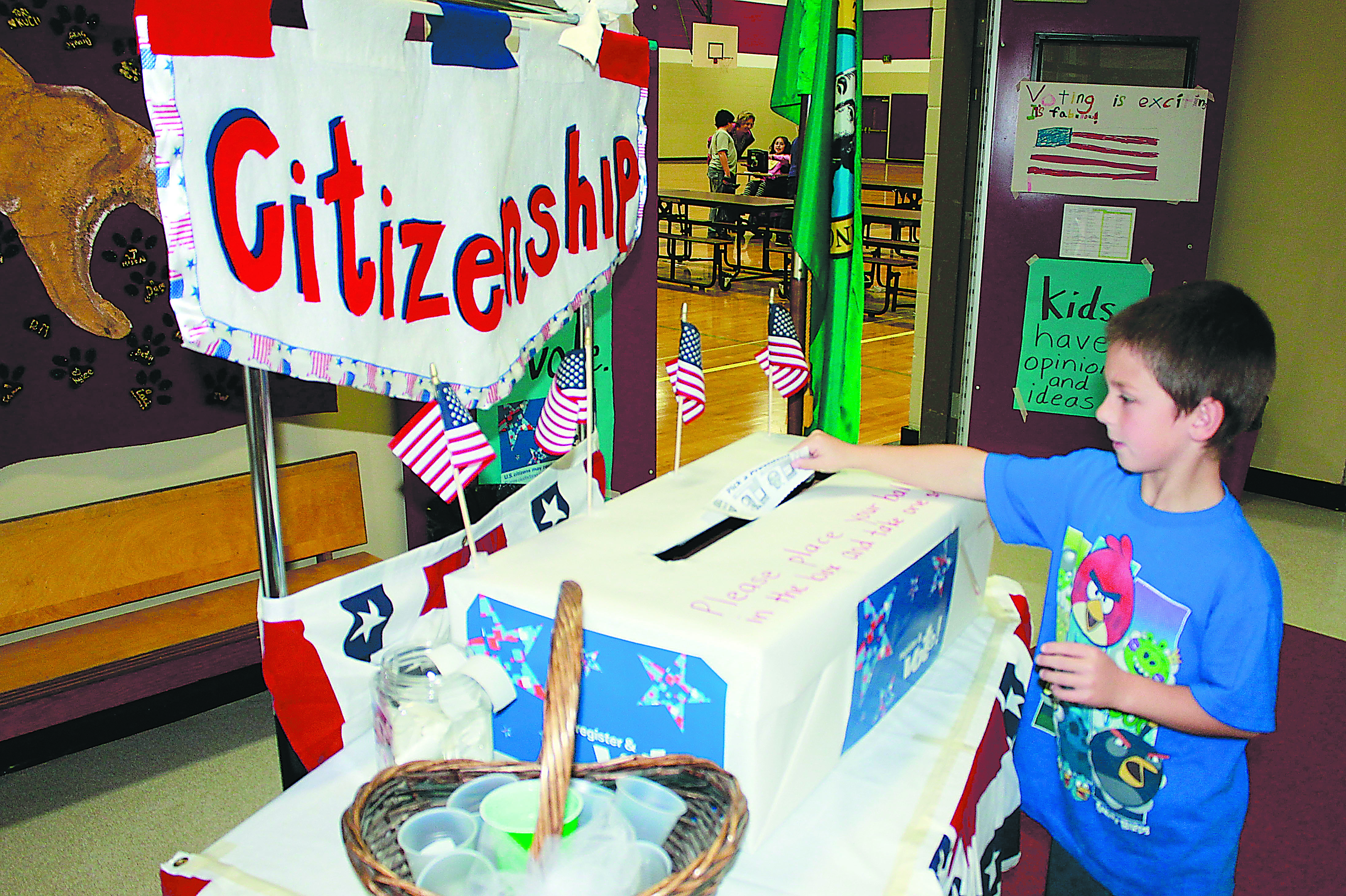 Second-grader David Zinn casts his vote Tuesday at Roosevelt Elementary School in Port Angeles. Port Angeles School District