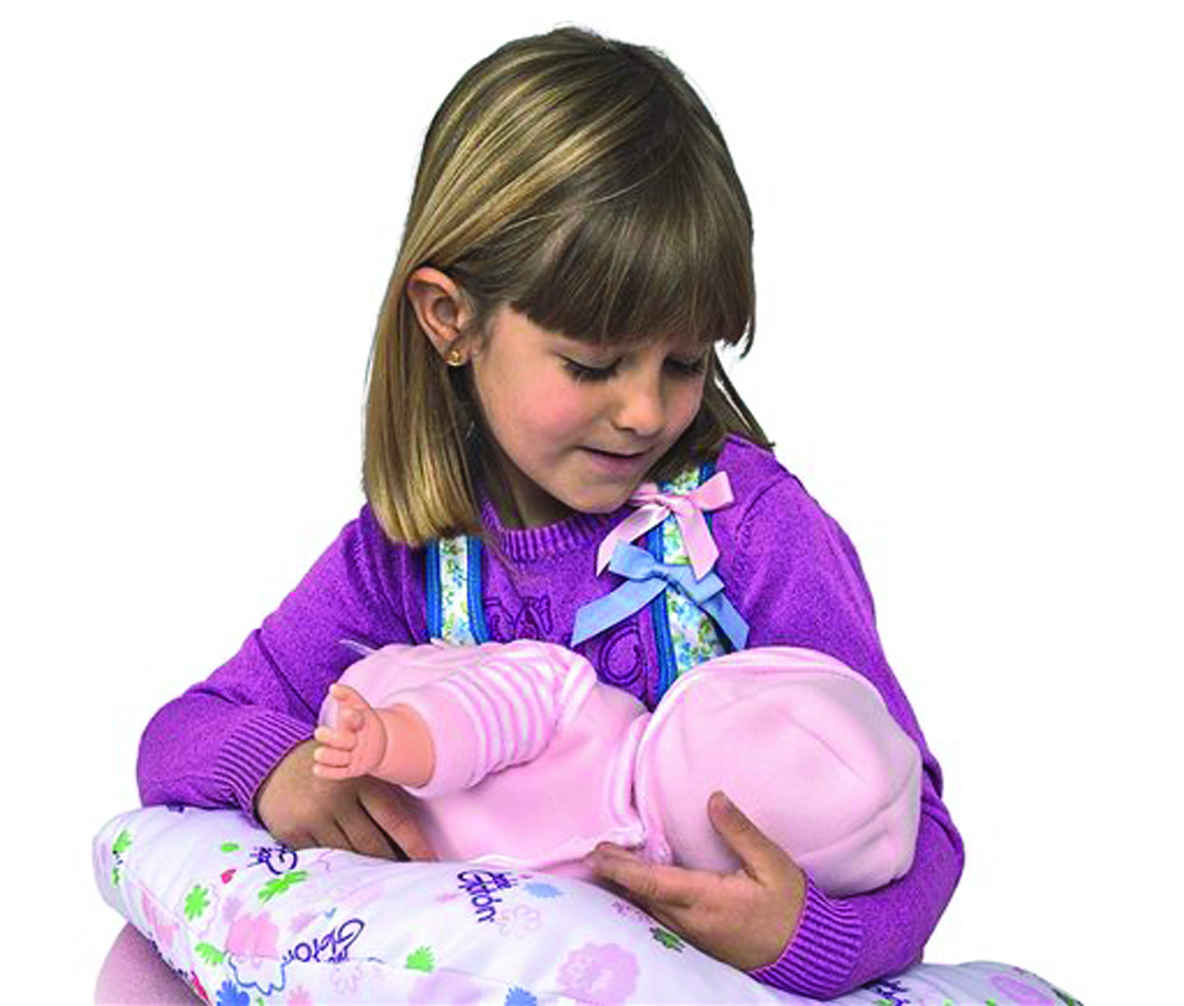 This product image released by Berjuan Toys shows a girl playing with The Breast Milk Baby doll. The breastfeeding doll