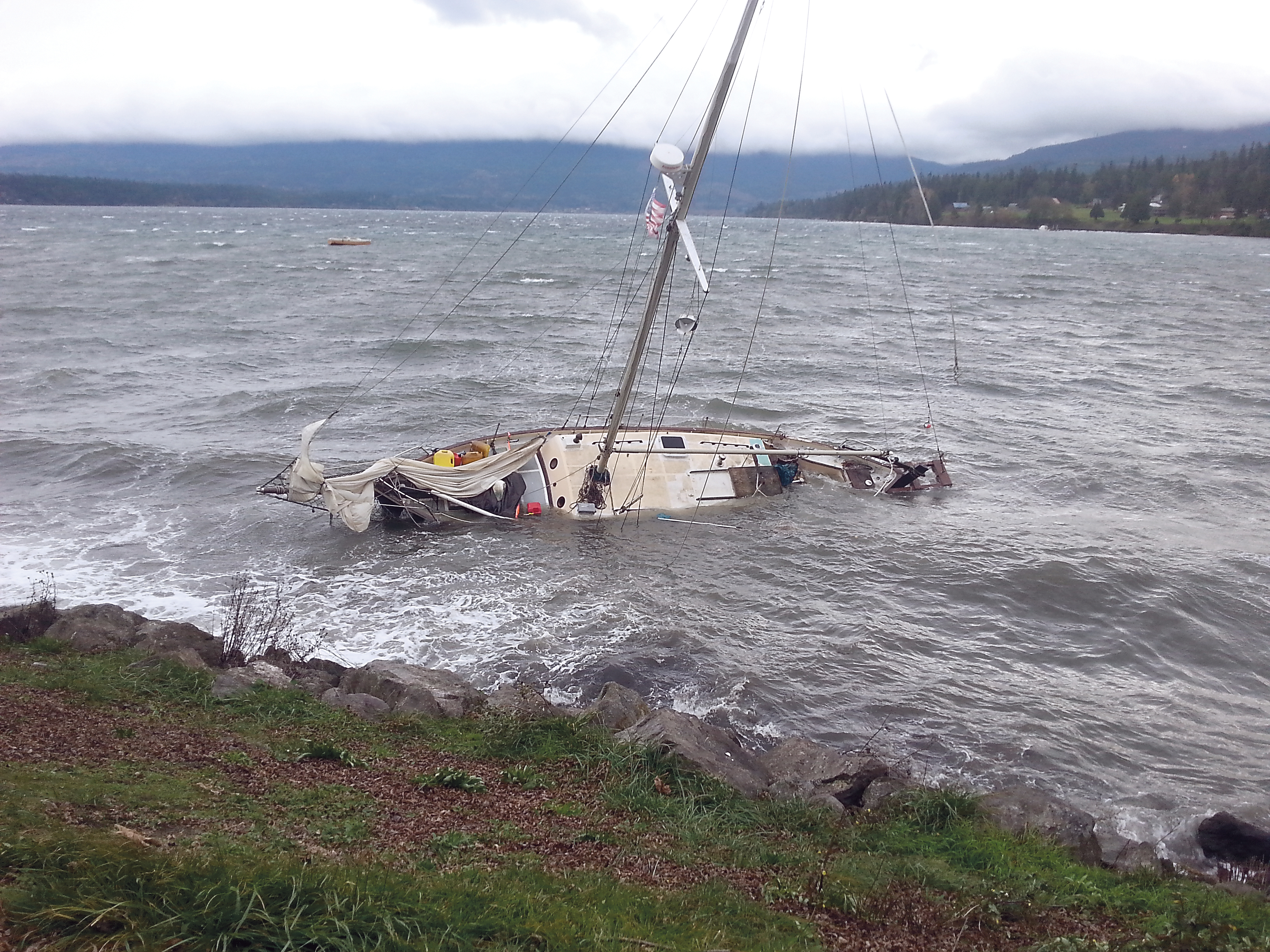 This sailboat anchored in Sequim Bay was beached by high winds Thursday morning