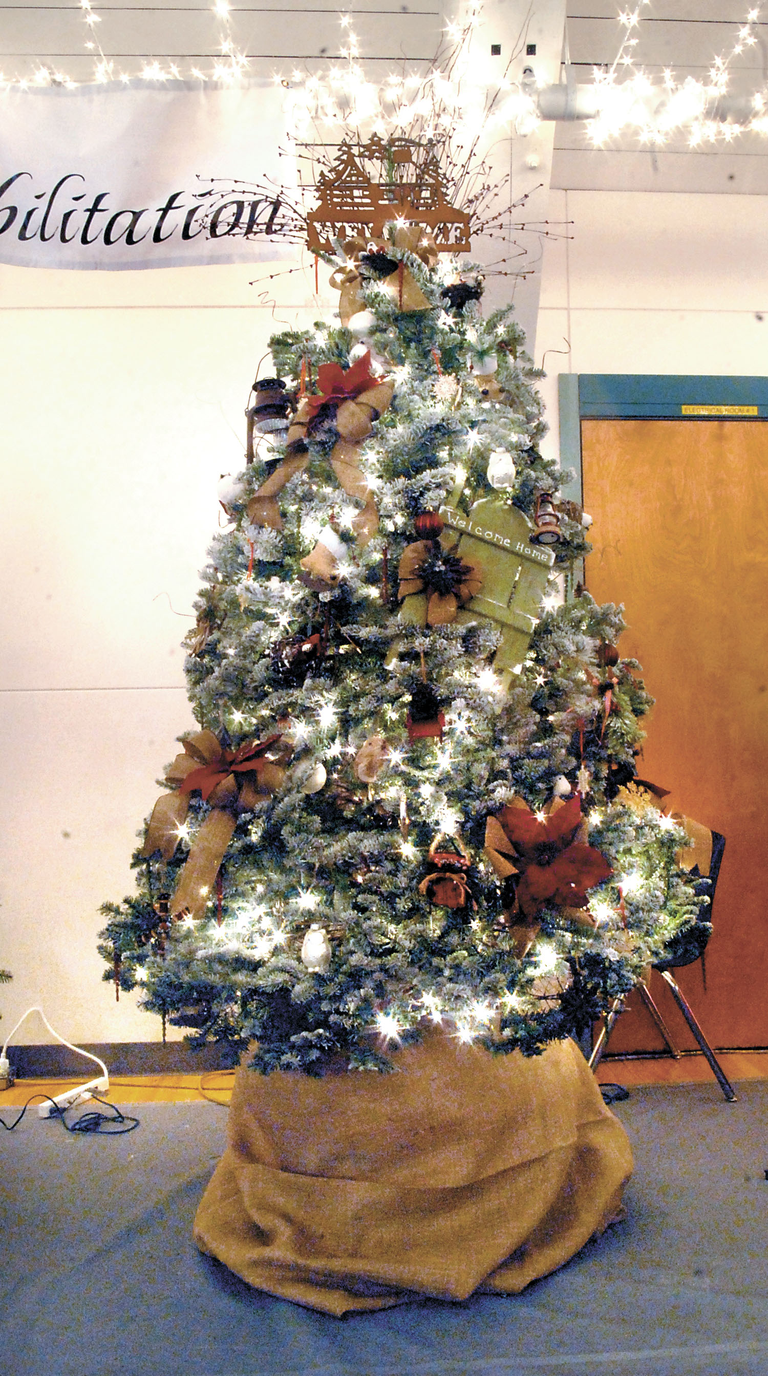 A Christmas tree titled “Welcome to Our Cabin