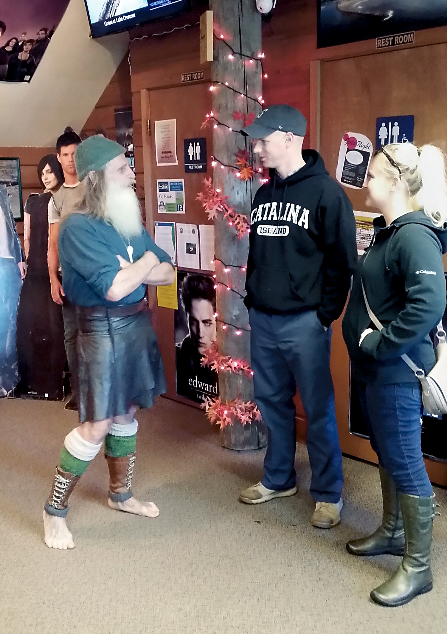 Danica and Hank Christiansen speak with Mick Dodge at the Forks Visitor Information Center.  Forks Chamber of Commerce