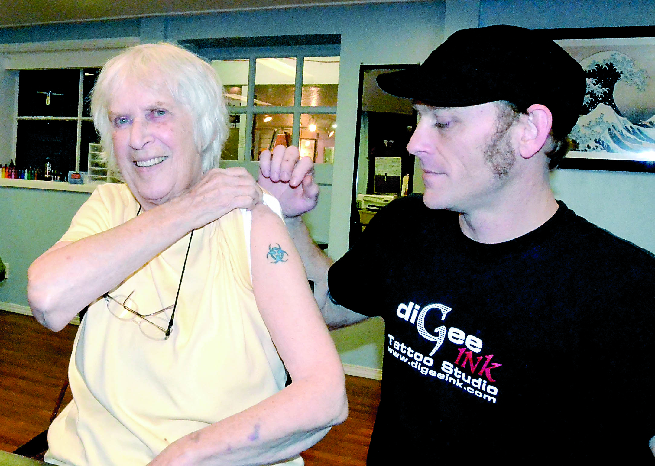 Peggy Smith shows off the tattoo that artist Gary Laxon