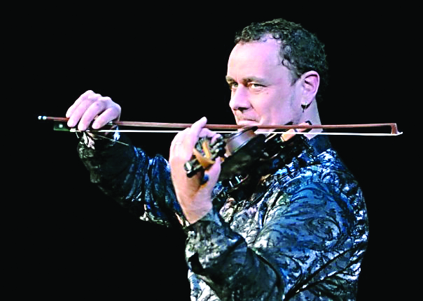 Geoffrey Castle will wield his electric violin in the Christmas extravaganza at the Port Angeles High School Performing Arts Center this Sunday.