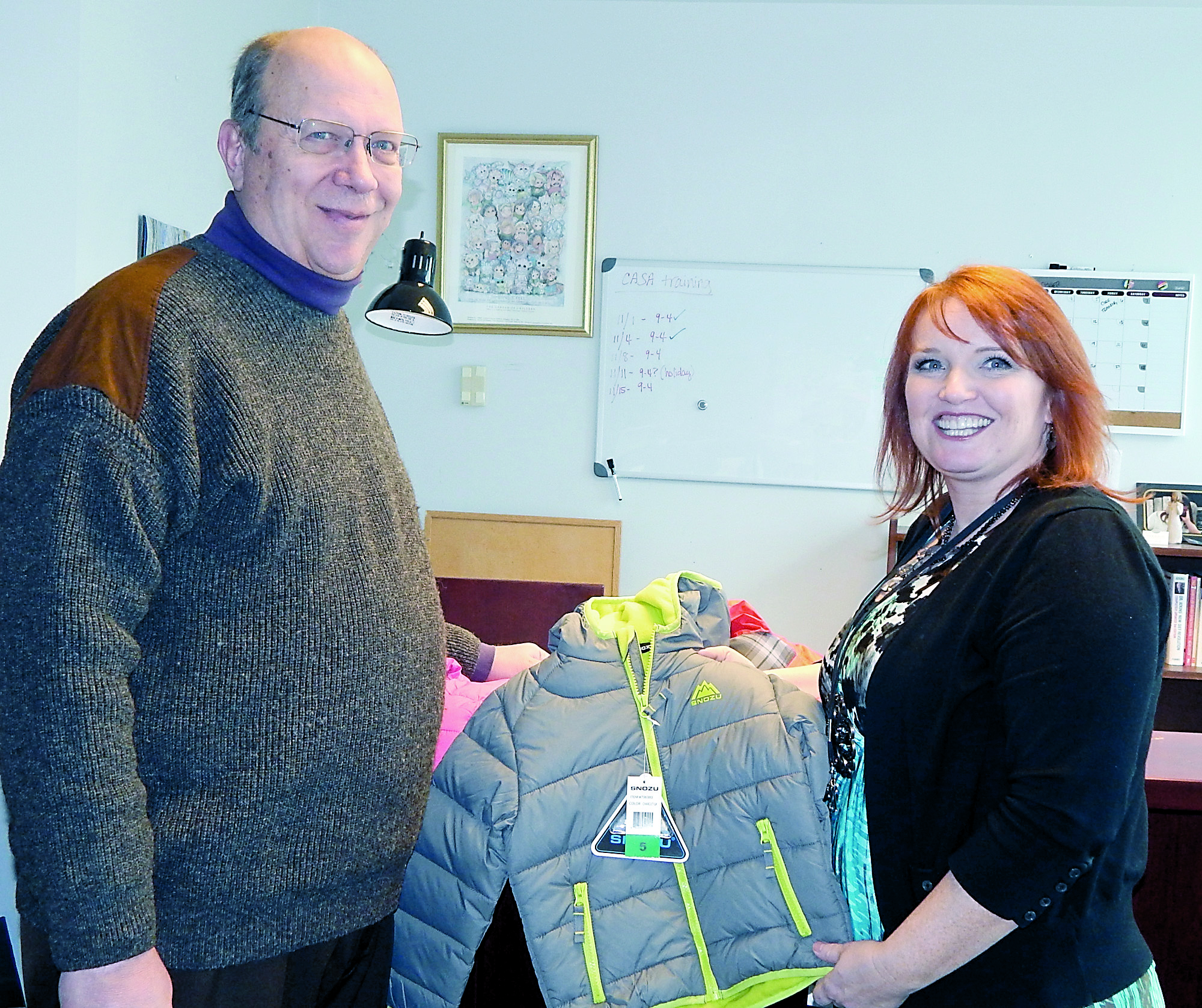 Court Appointed Special Advocate program coordinator Valerie Brooks of Clallam County Juvenile and Family Services thanks Jim Fryxell