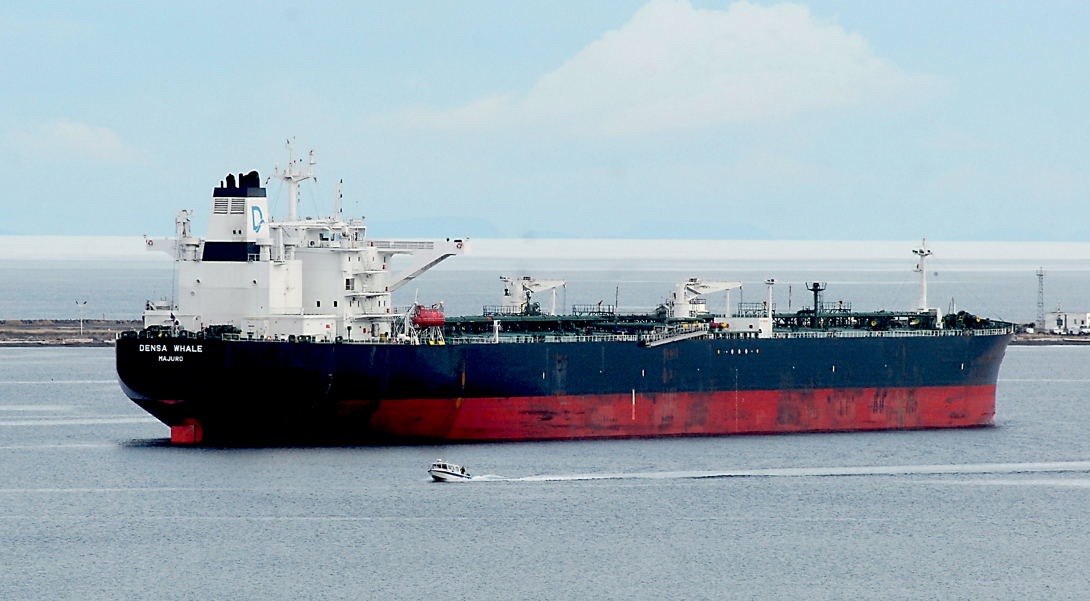 The Marshall Islands-flagged tanker ship Densa Whale sits anchored in Port Angeles Harbor on Saturday after visiting BP's Cherry Point refinery earlier in the week. Tankers servicing Canadian oil could add to traffic on the Strait of Juan de Fuca north of the border. —Photo by Keith Thorpe/Peninsula Daily News