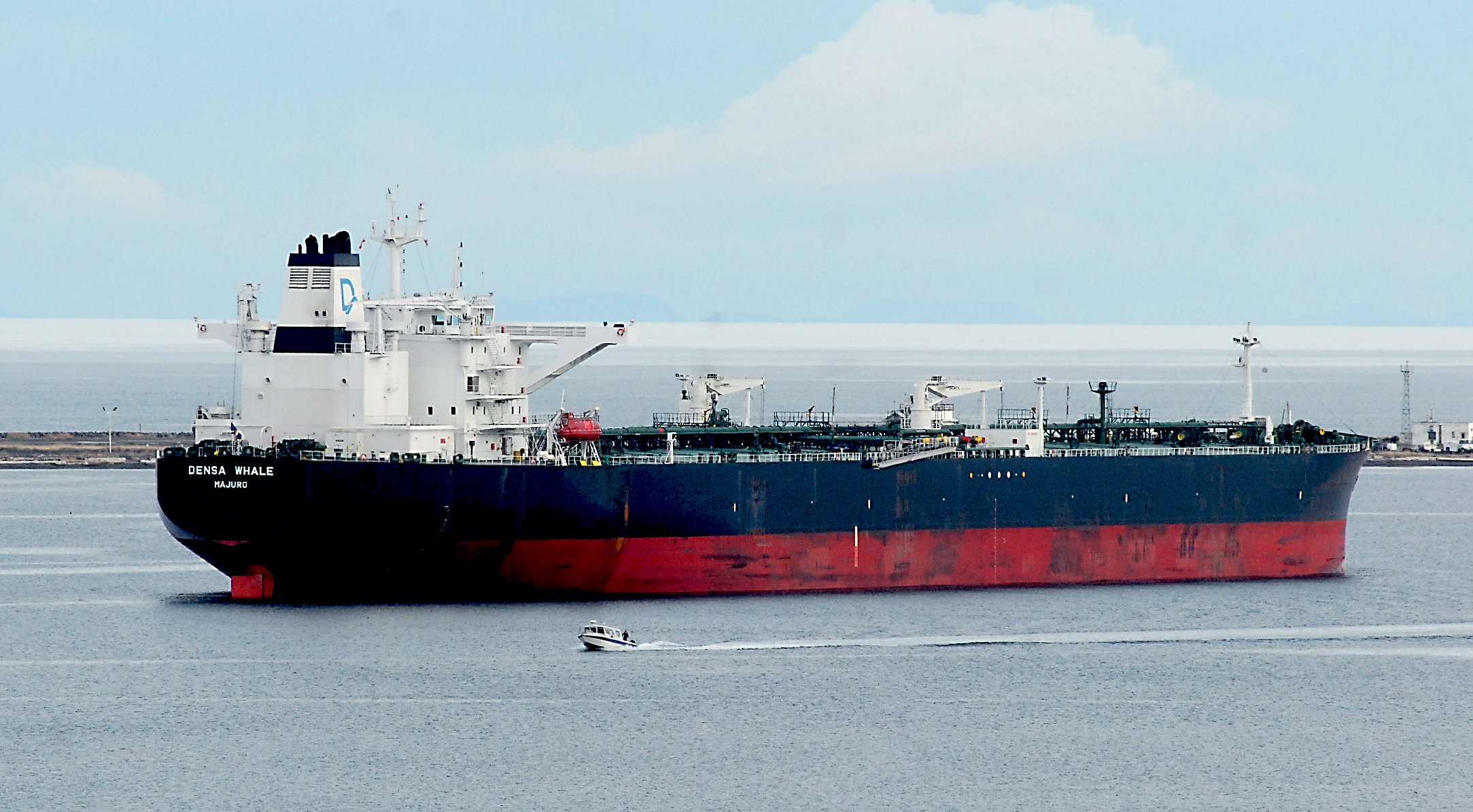 The Marshall Islands-flagged tanker ship Densa Whale sits anchored in Port Angeles Harbor on Saturday after visiting BP's Cherry Point refinery earlier in the week. Tankers servicing Canadian oil could add to traffic on the Strait of Juan de Fuca north of the border.  —Photo by Keith Thorpe/Peninsula Daily News