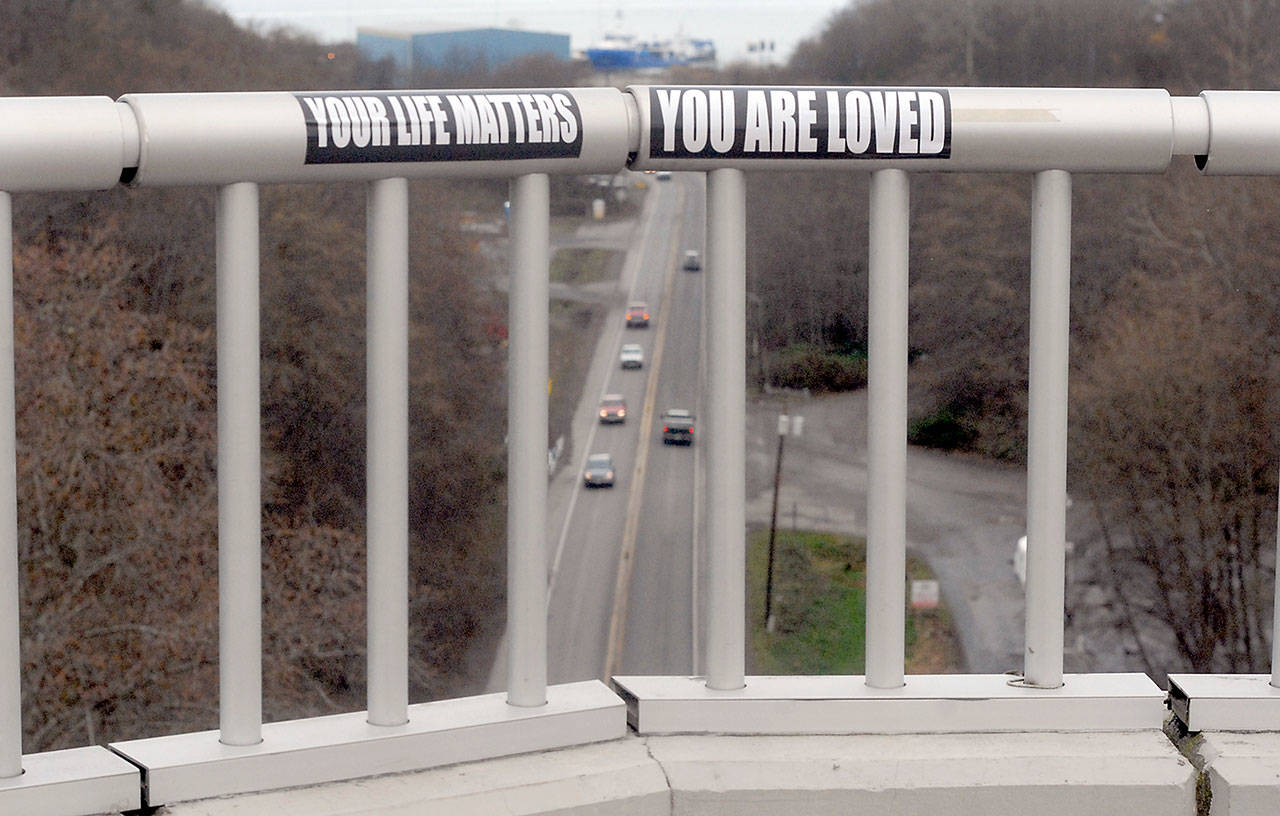 Affirmational stickers have been attached to the railings on the West Eighth Street bridge over the Tumwater Truck Route in Port Angeles near the location where people have committed suicide by leaping from the span. (Keith Thorpe/Peninsula Daily News)