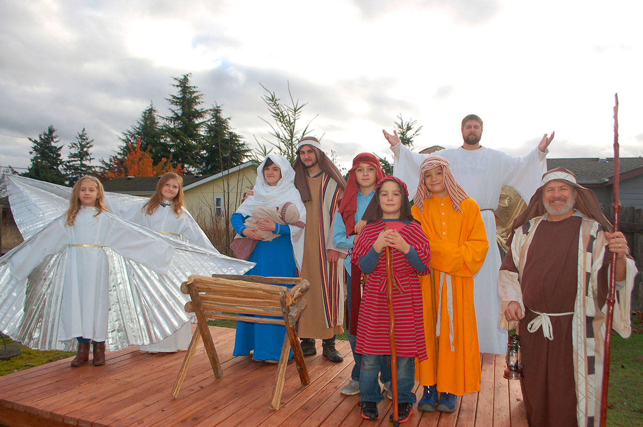Actors from Sequim Valley Nazarene Church, from back left, Emery Merrikin, Breanna Mollinet, Natalie Luengen, Jackson Thomas and David Merrikin, and front left, Ethan Merrikin, Marcus Byrne, Malachi Byrne and Pastor Jerry Luengen are gearing up to perform a “Living Nativity” tour for the Sequim community from 4 p.m. 8 p.m. this Saturday and Dec. 16. (Erin Hawkins/Olympic Peninsula News Group)