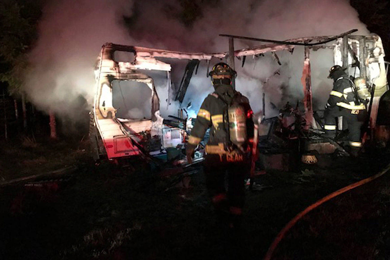Man, son escape injury when fire destroys travel trailer near Port Angeles