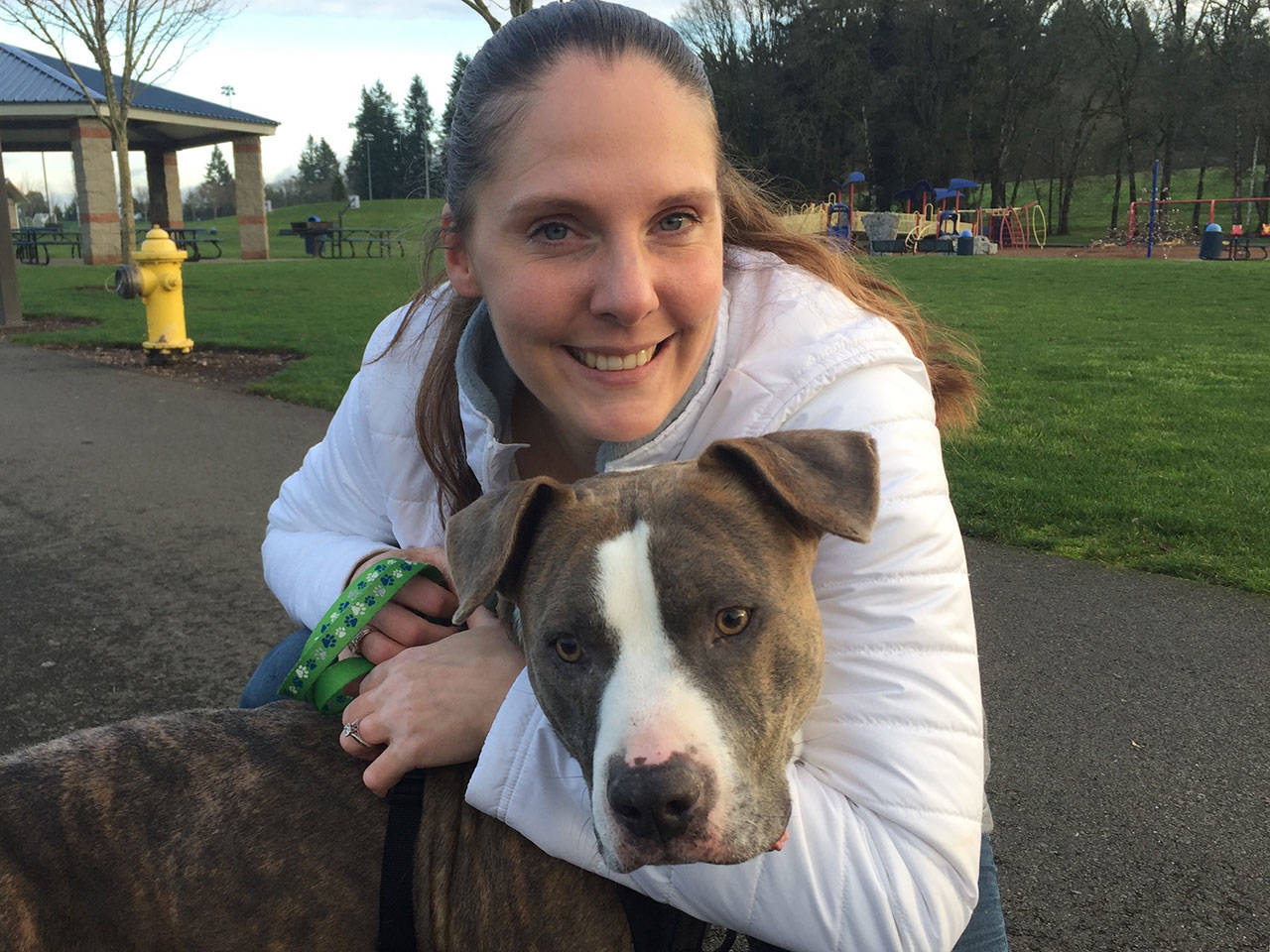Kim Hopkins was reunited Dec. 4 with her dog Deuce after six years apart. (Lisa Pemberton /The Olympian via AP)