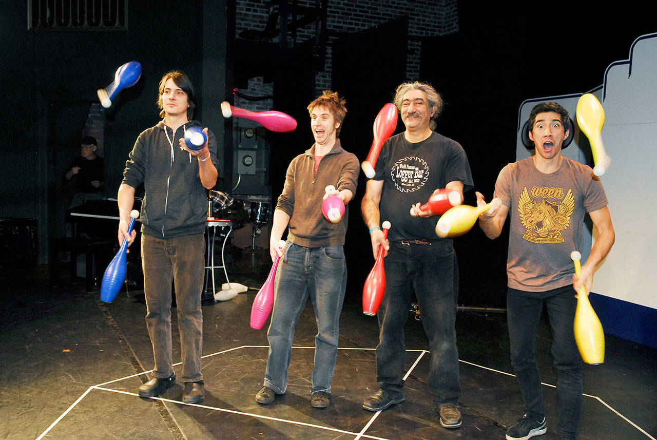 The Flying Karamazov Brothers are back in Port Townsend. Here the boys warm up with a juggling routine during rehearsal Monday at the Wheeler Theater, Fort Worden, Port Townsend. The performers are, from left, Chen Pollina, Jules McCoy, Paul Magid — one of the original founders — and Tomoki Sage. (Jeannie McMacken/for Peninsula Daily News)