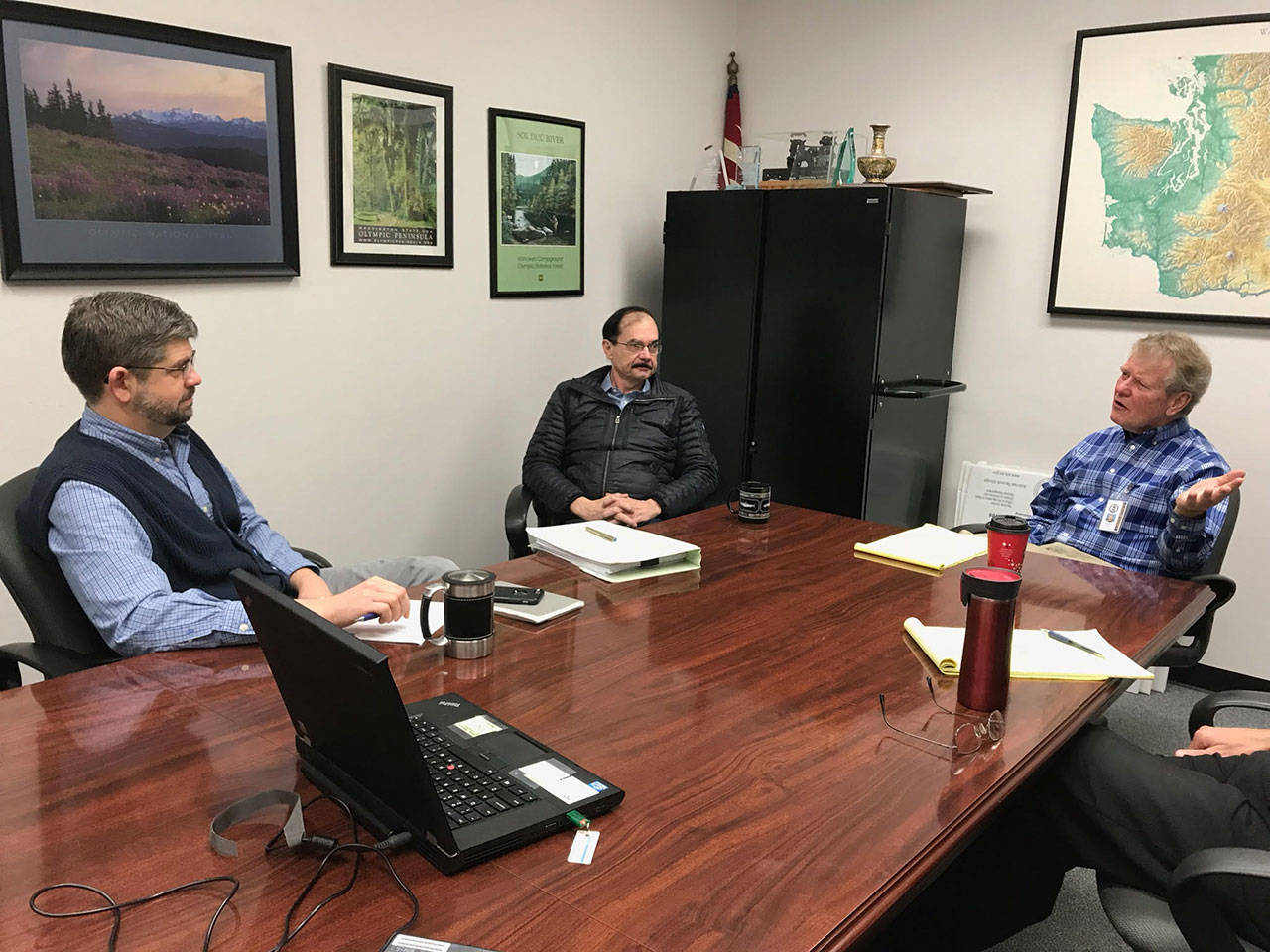 From left, Clallam County commissioners Mark Ozias, Bill Peach and Randy Johnson discuss creating a finance department within county government Tuesday at their monthly long-range planning meeting. (Paul Gottlieb/Peninsula Daily News)