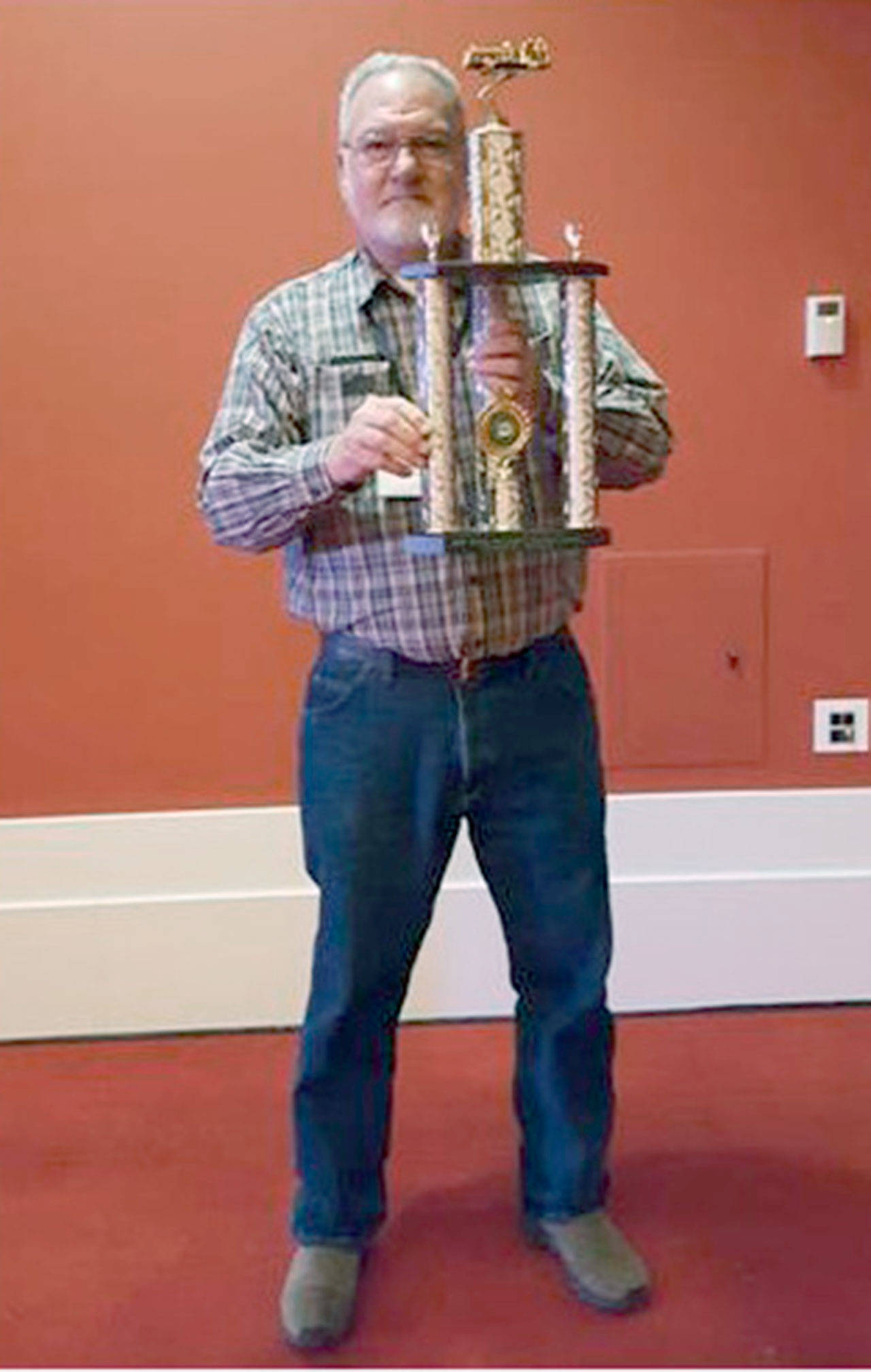 Commissioner Terry Barnett holds the first-place trophy Clallam County Fire District No. 4 received from the state Fire Commissioner’s Association. (Clallam County Fire District No. 4)