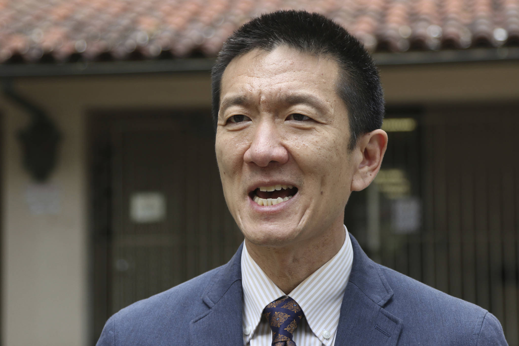 Hawaii Attorney General Douglas Chin speaks to The Associated Press in Honolulu on Oct. 17 about Hawaii’s lawsuit challenging President Donald Trump’s travel ban. (Caleb Jones/The Associated Press)