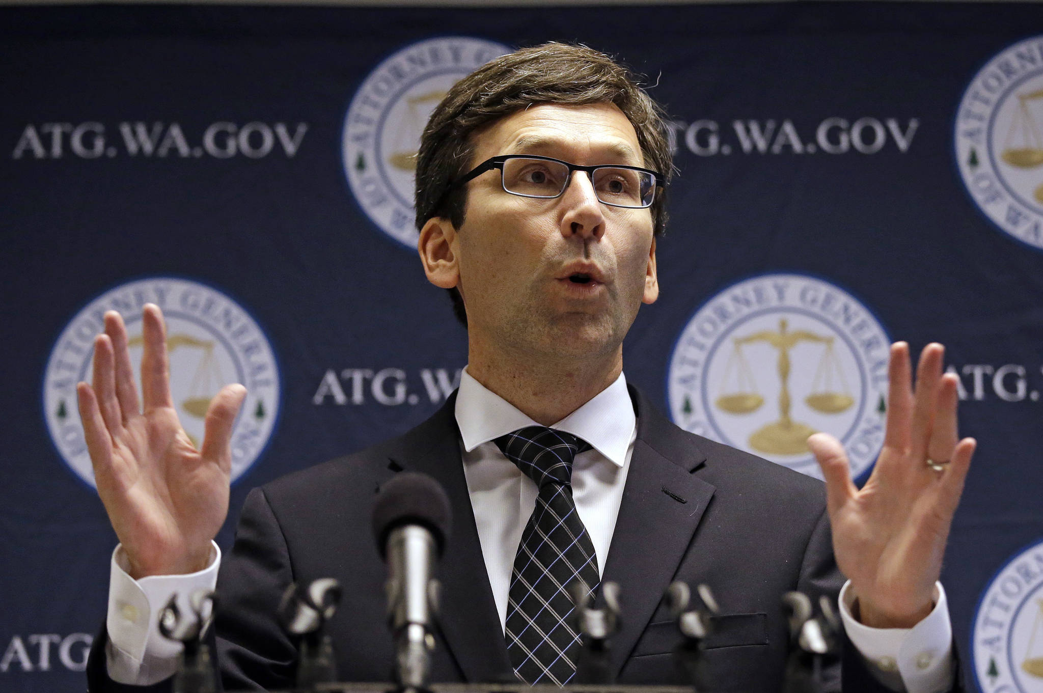 Washington state Attorney General Bob Ferguson speaks on Nov. 28 at a news conference in Seattle. (Elaine Thompson/The Associated Press)