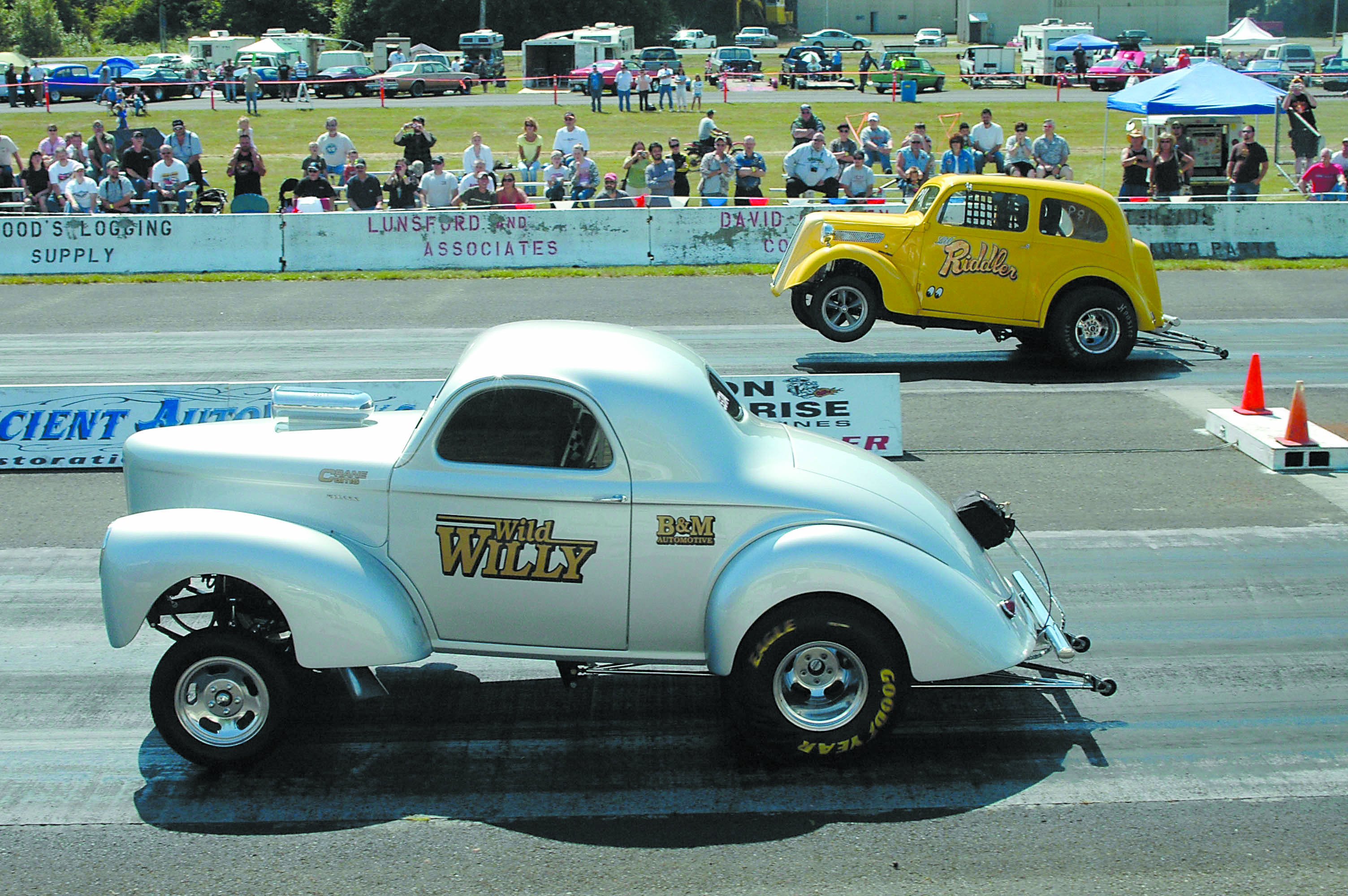 Two hotrods leave the starting line at the 2009 West End Thunder races at Forks Municipal Airport. Lonnie Archibald/For Peninsula Daily News