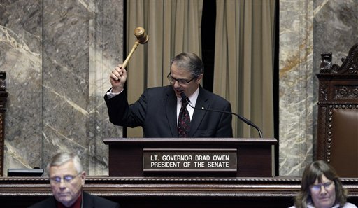 Lt. Gov. Brad Owen bangs the gavel for the final time to end a double-overtime legislature session early this morning at the state Capitol in Olympia. Ted S. Warren/The Associated Press