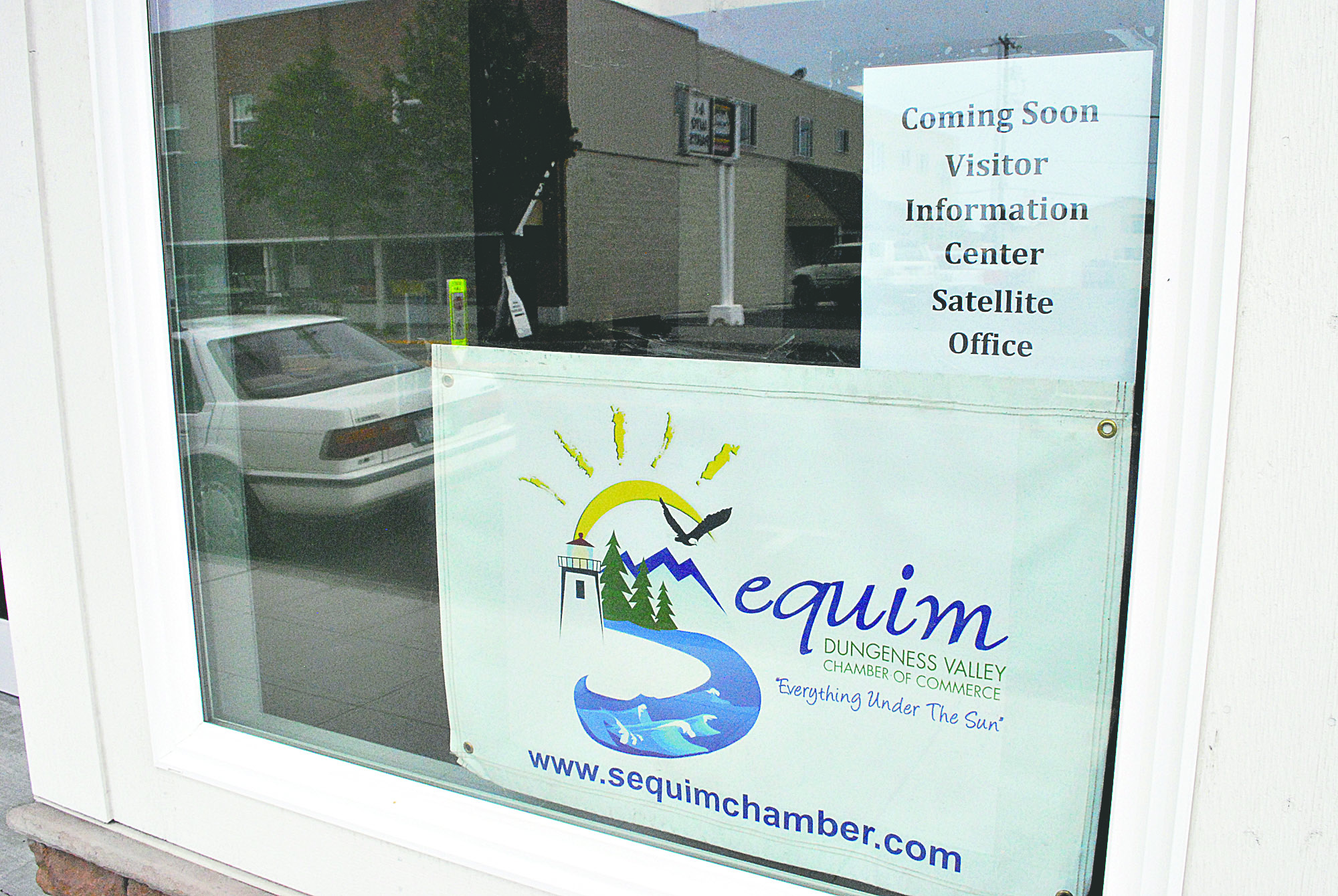A sign announces the opening of the satellite visitor center in downtown Sequim. Jeff Chew/Peninsula Daily News