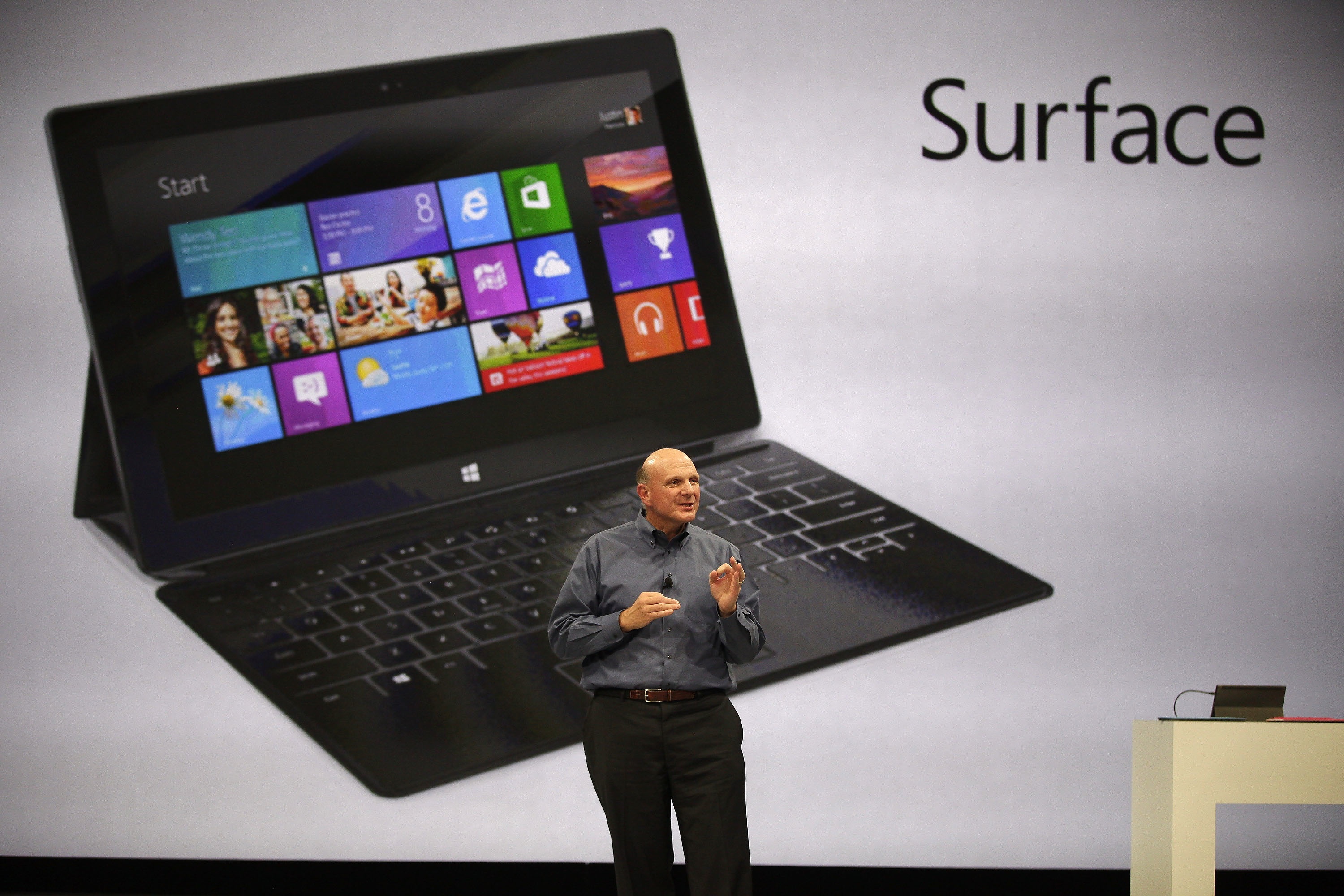 Microsoft CEO Steve Baller announces 'Surface' as a photo of the new tablet is shown behind him. The Associated Press