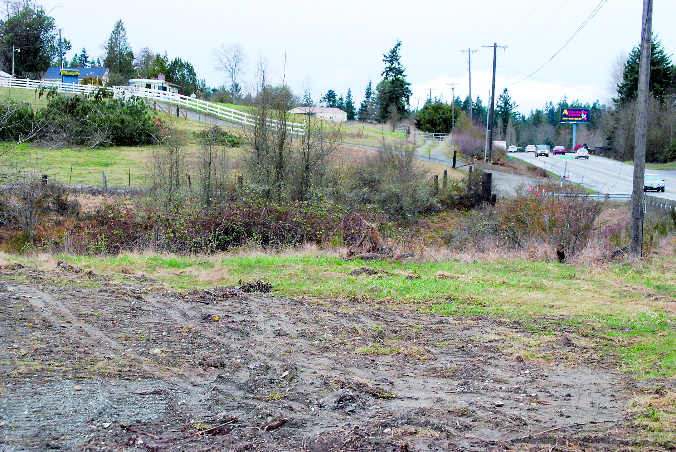 Signs of clearing along the future widened route of U.S. Highway 101 between Sequim and Port Angeles include this former home site. Jeff Chew/Peninsula Daily News