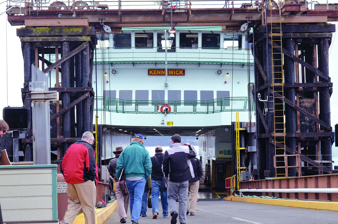 The first passengers board the MV Kennewick for its maiden voyage in February. Charlie Bermant/Peninsula Daily News