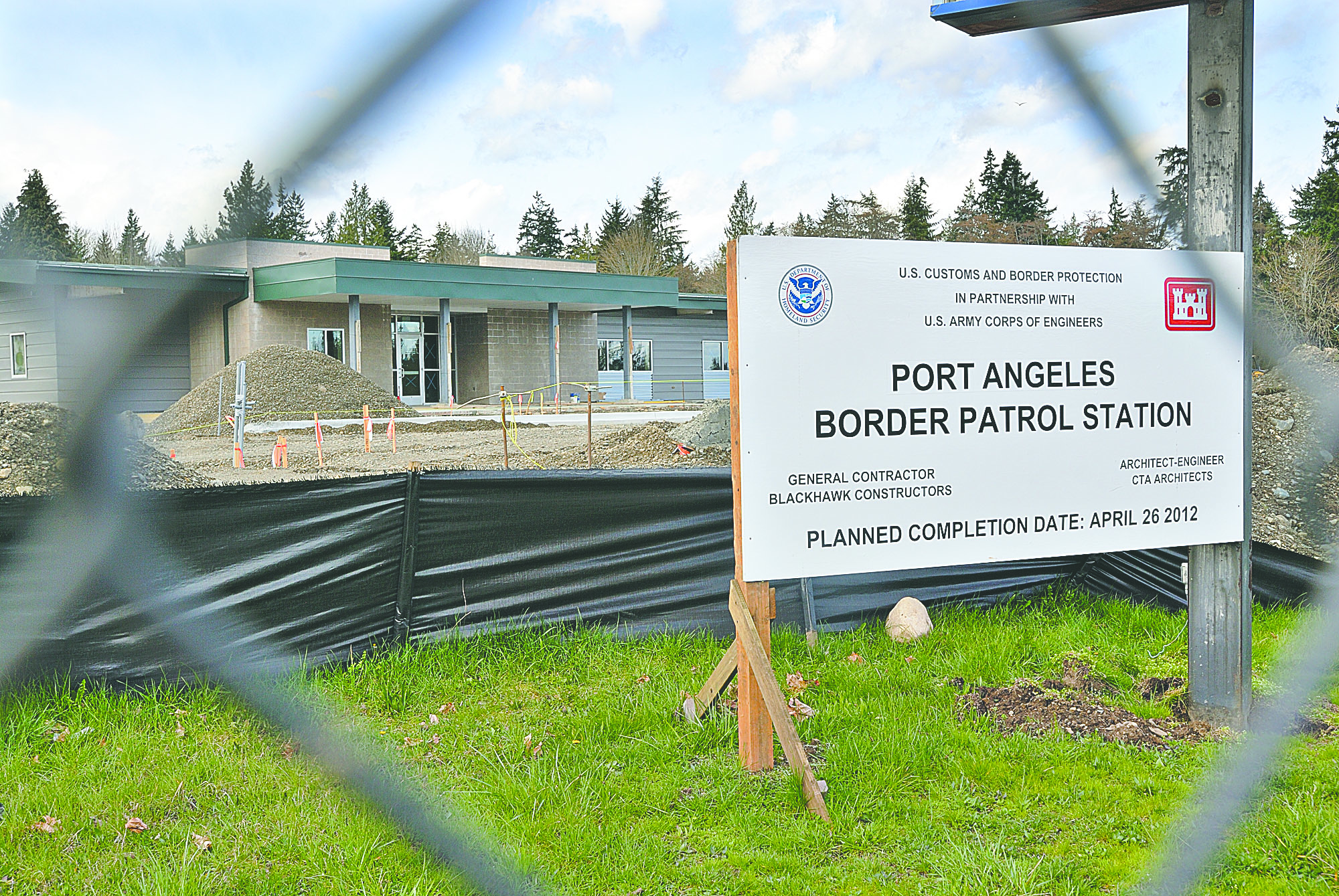A sign outside the Border Patrol station announces its expected completion date in April. Chris Tucker/Peninsula Daily News