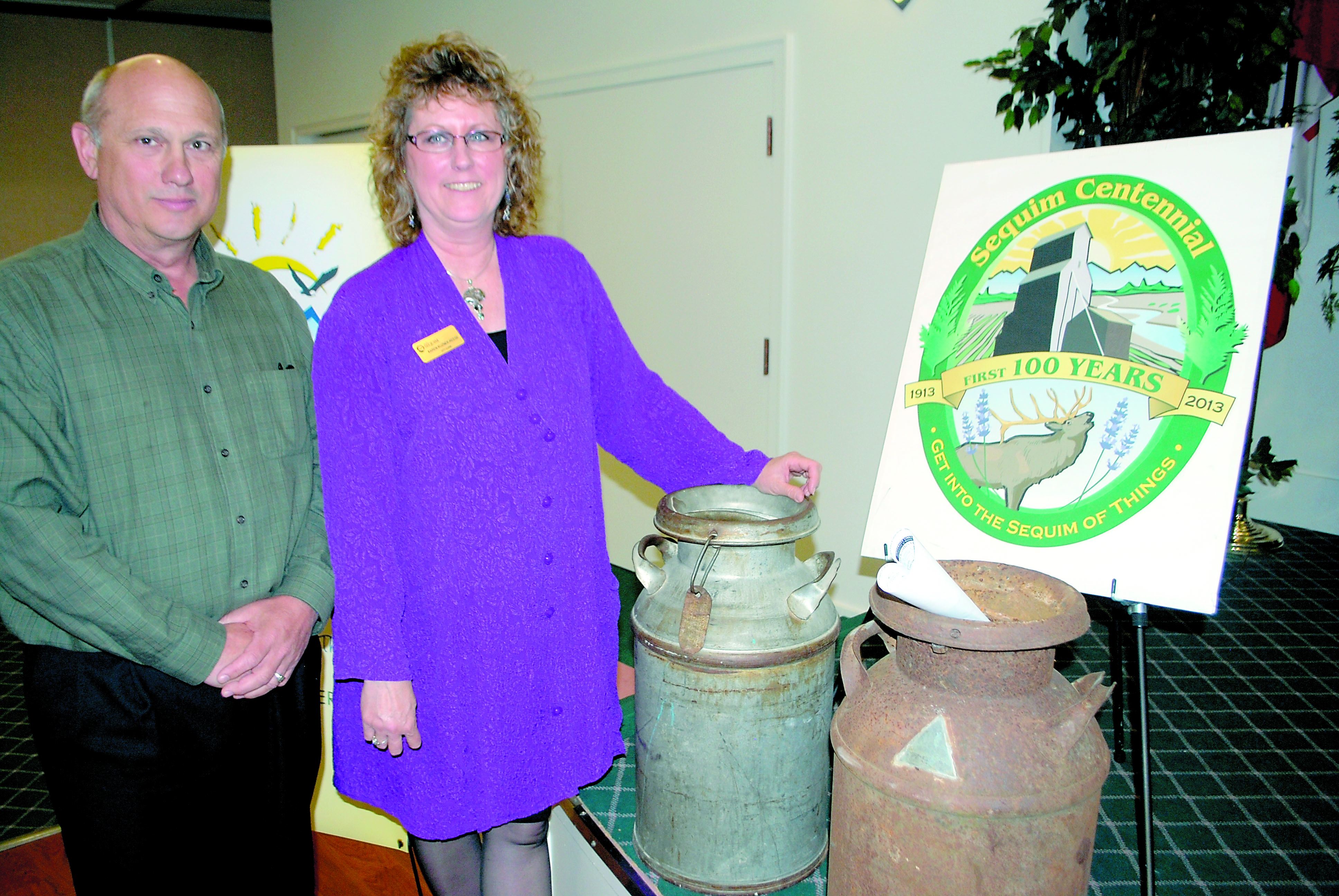 Mayor Ken Hays and Sequim City Clerk Karen Kuznek-Reese spoke about the centennial at Tuesday's Sequim-Dungeness Valley Chamber of Commerce meeting. Jeff Chew/Peninsula Daily News